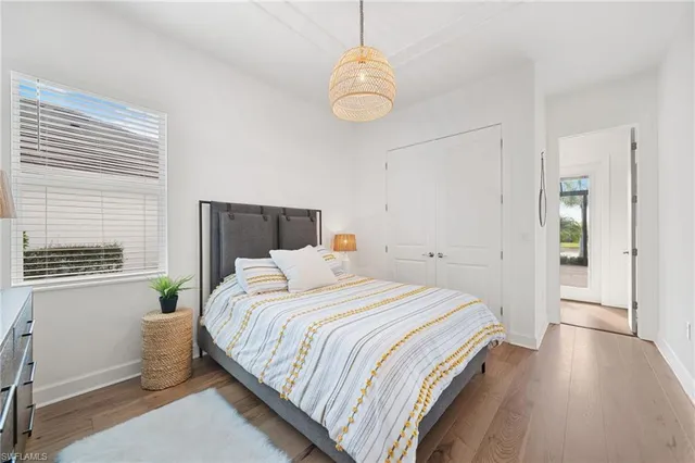 a bathroom with a sink a toilet and a large mirror