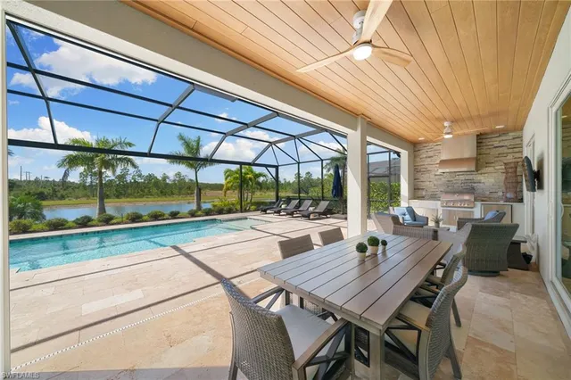 a view of a patio with a table and chairs