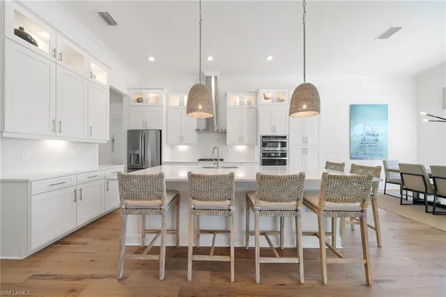 a view of kitchen with table and chairs