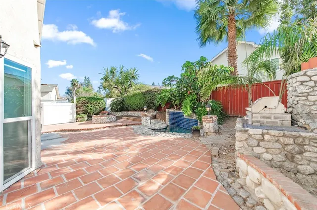 a view of a backyard with sitting area