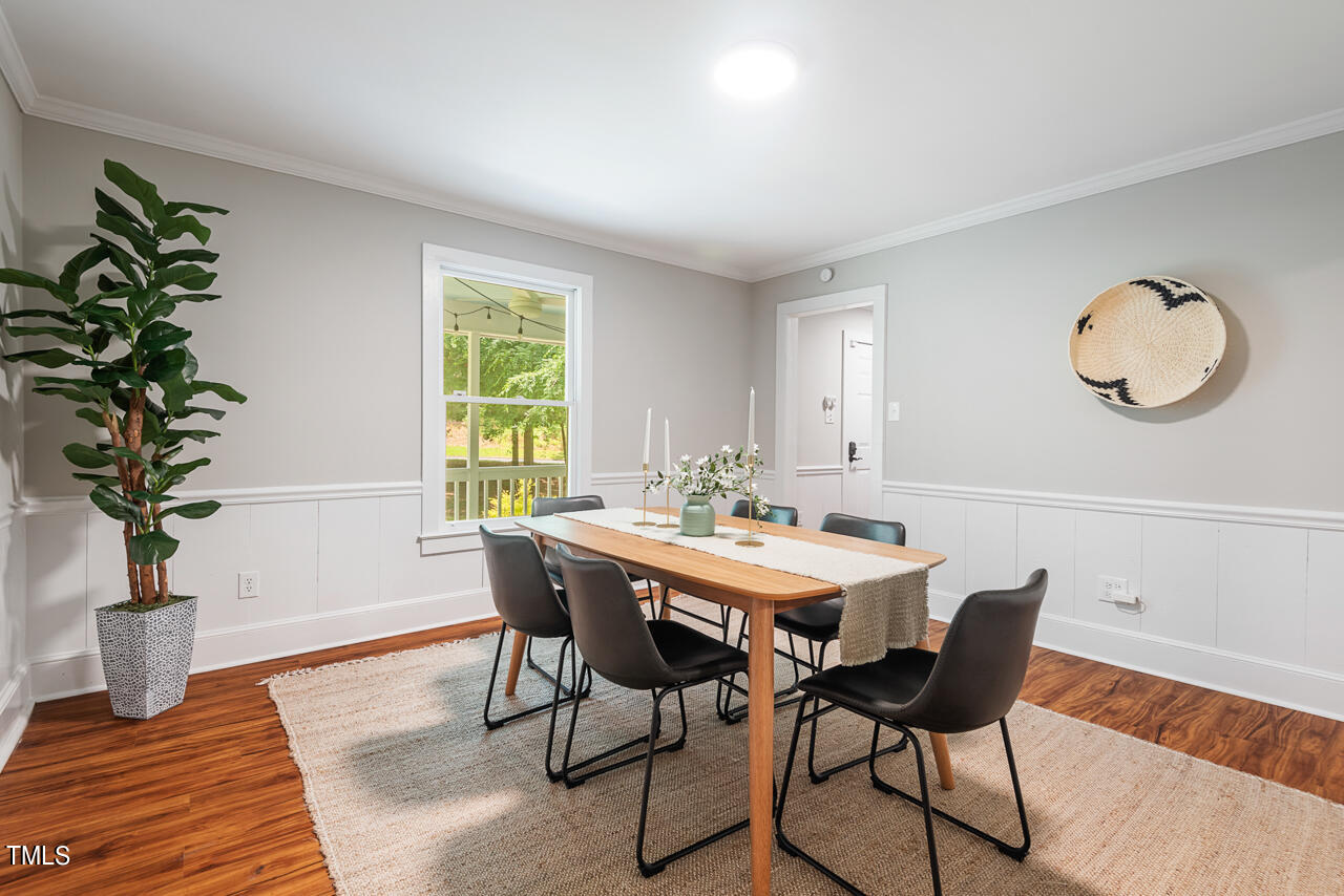 4102 Trotter Ridge Road Durham, NC 27707 - Photo 12 of 41 a view of a dining room with furniture window and wooden floor