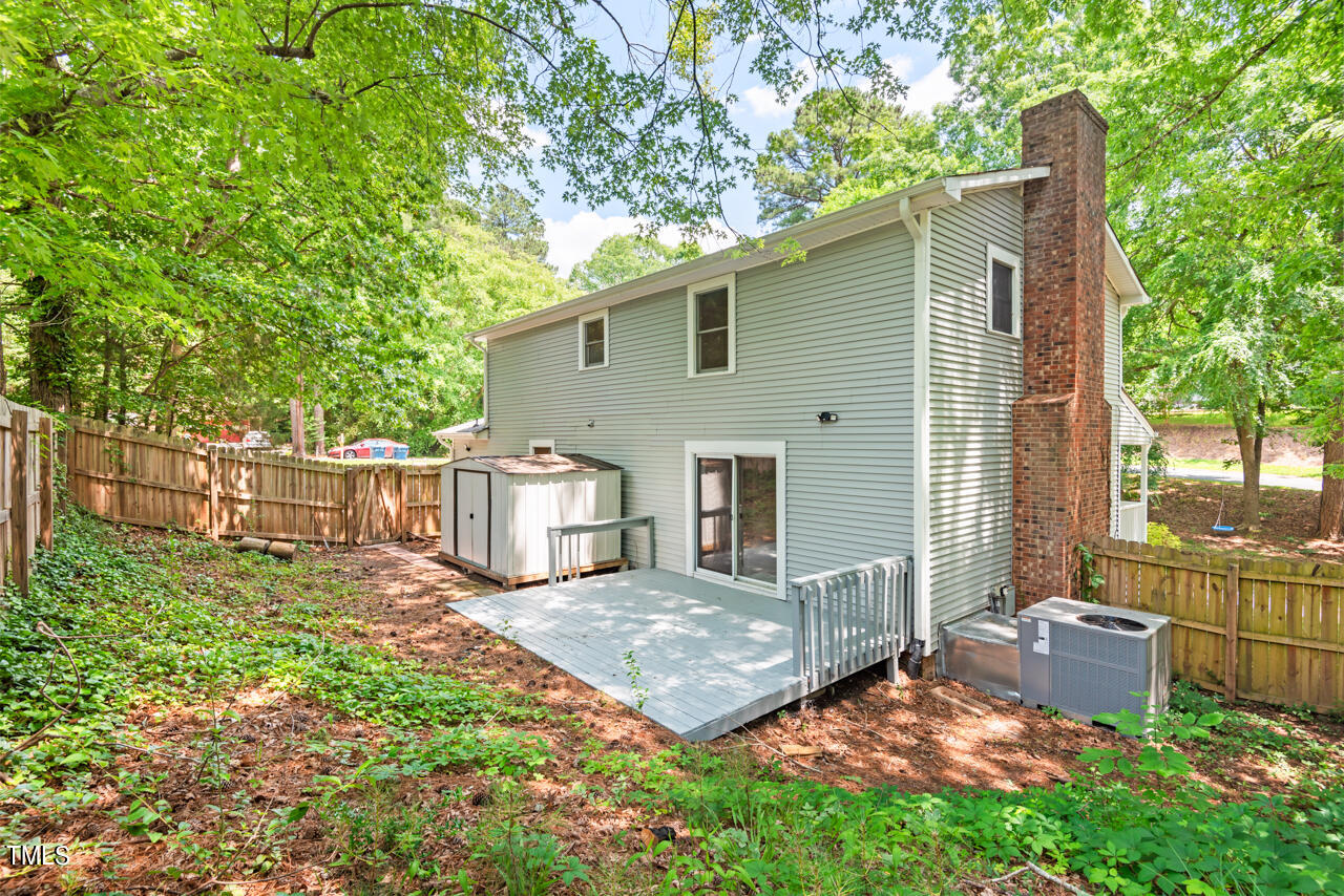 4102 Trotter Ridge Road Durham, NC 27707 - Photo 34 of 41 a view of a house with backyard and sitting area