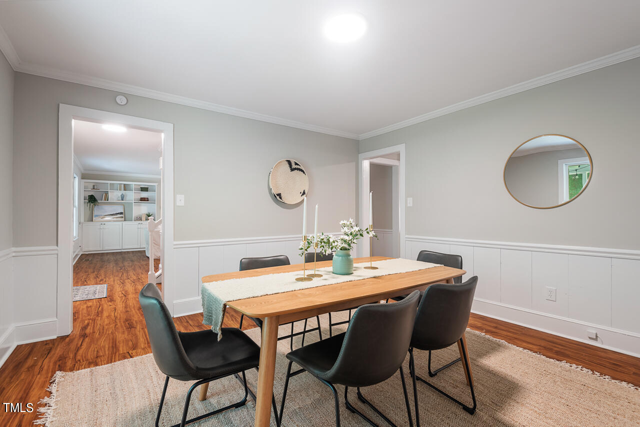 4102 Trotter Ridge Road Durham, NC 27707 - Photo 10 of 41 a view of a dining room with furniture and wooden floor