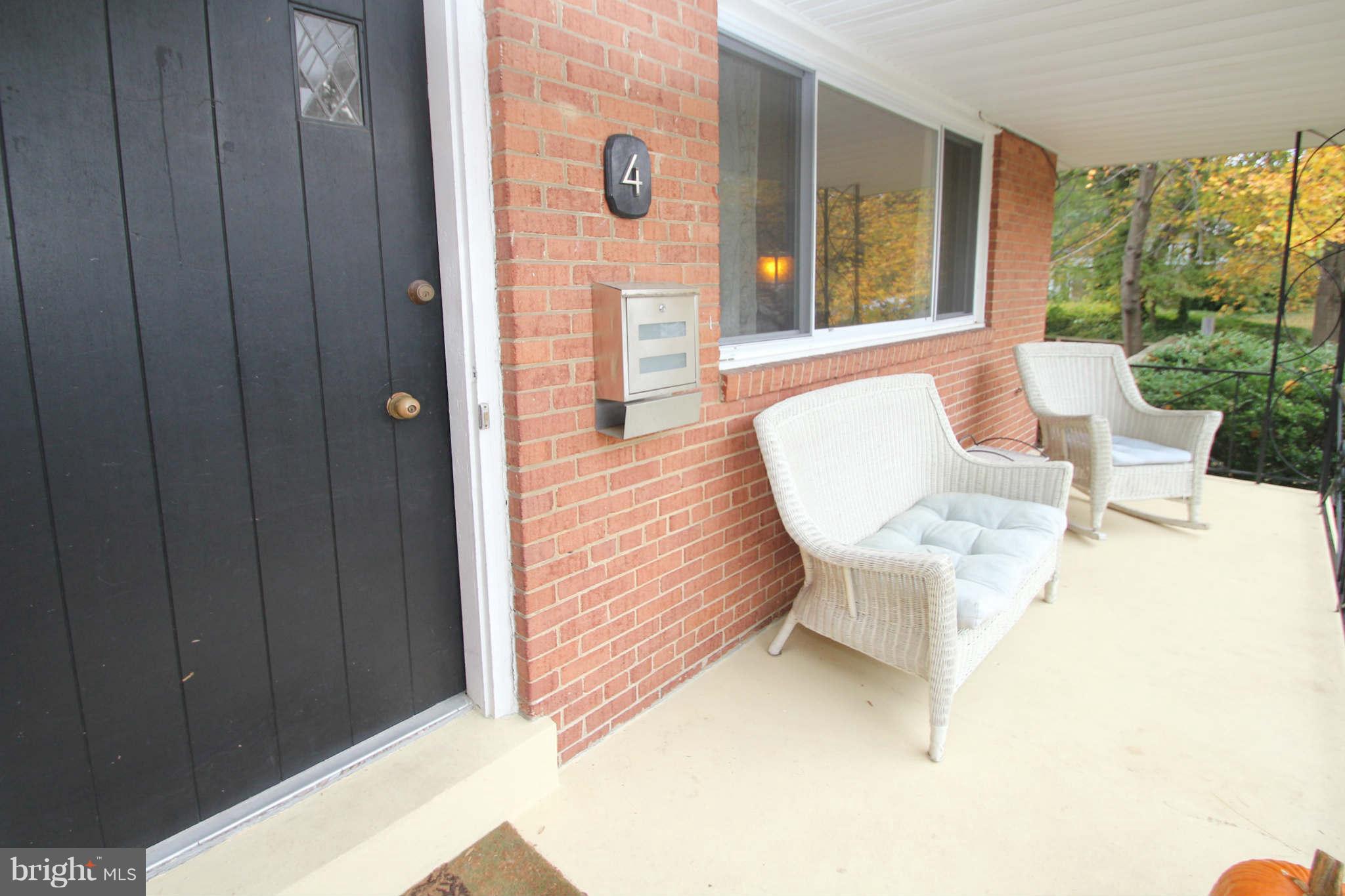 4 Oldham Road Silver Spring, MD 20901 - Photo 2 of 27 a balcony with table and chairs