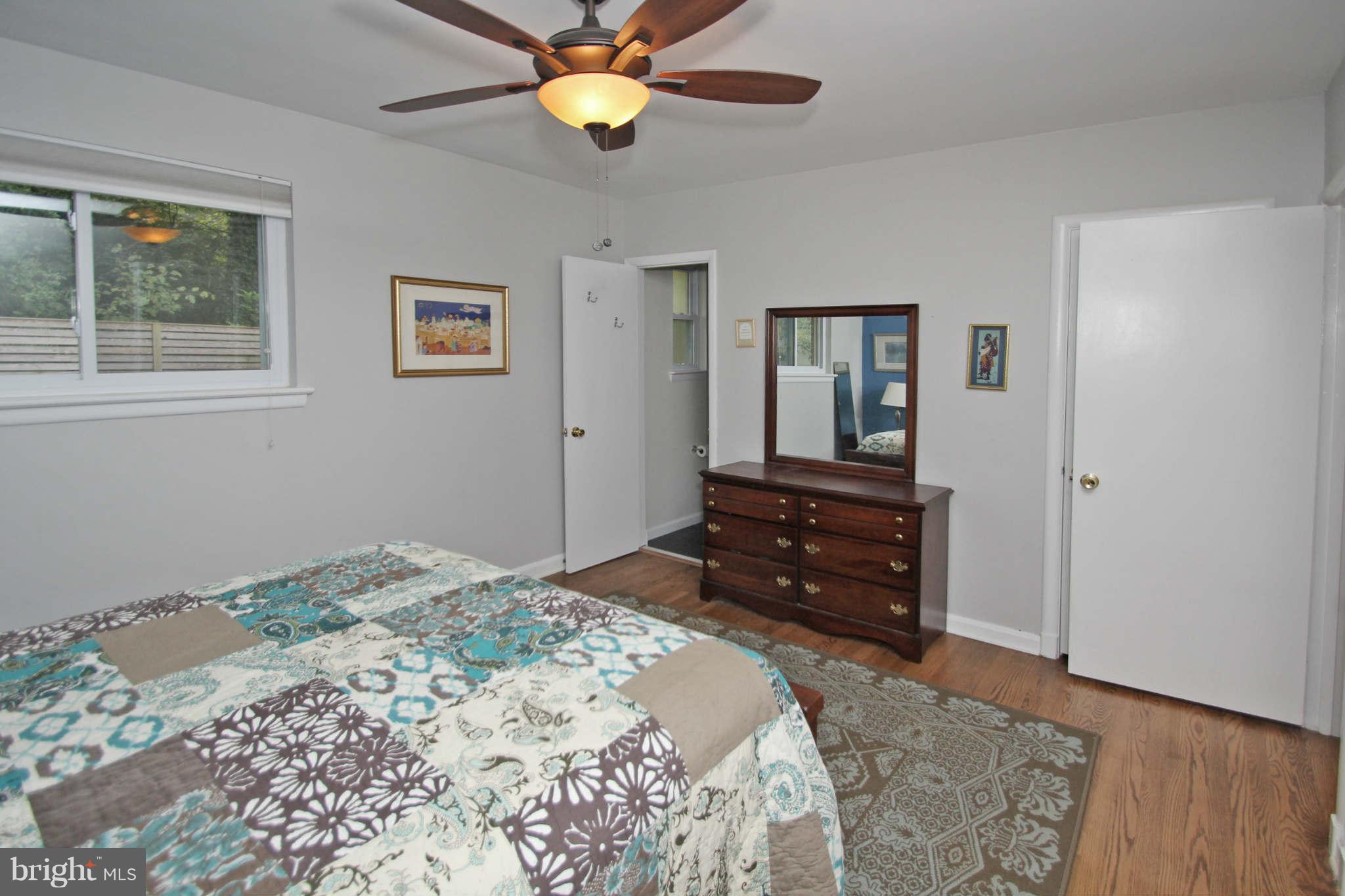 4 Oldham Road Silver Spring, MD 20901 - Photo 15 of 27 a bedroom with a bed and wooden floor