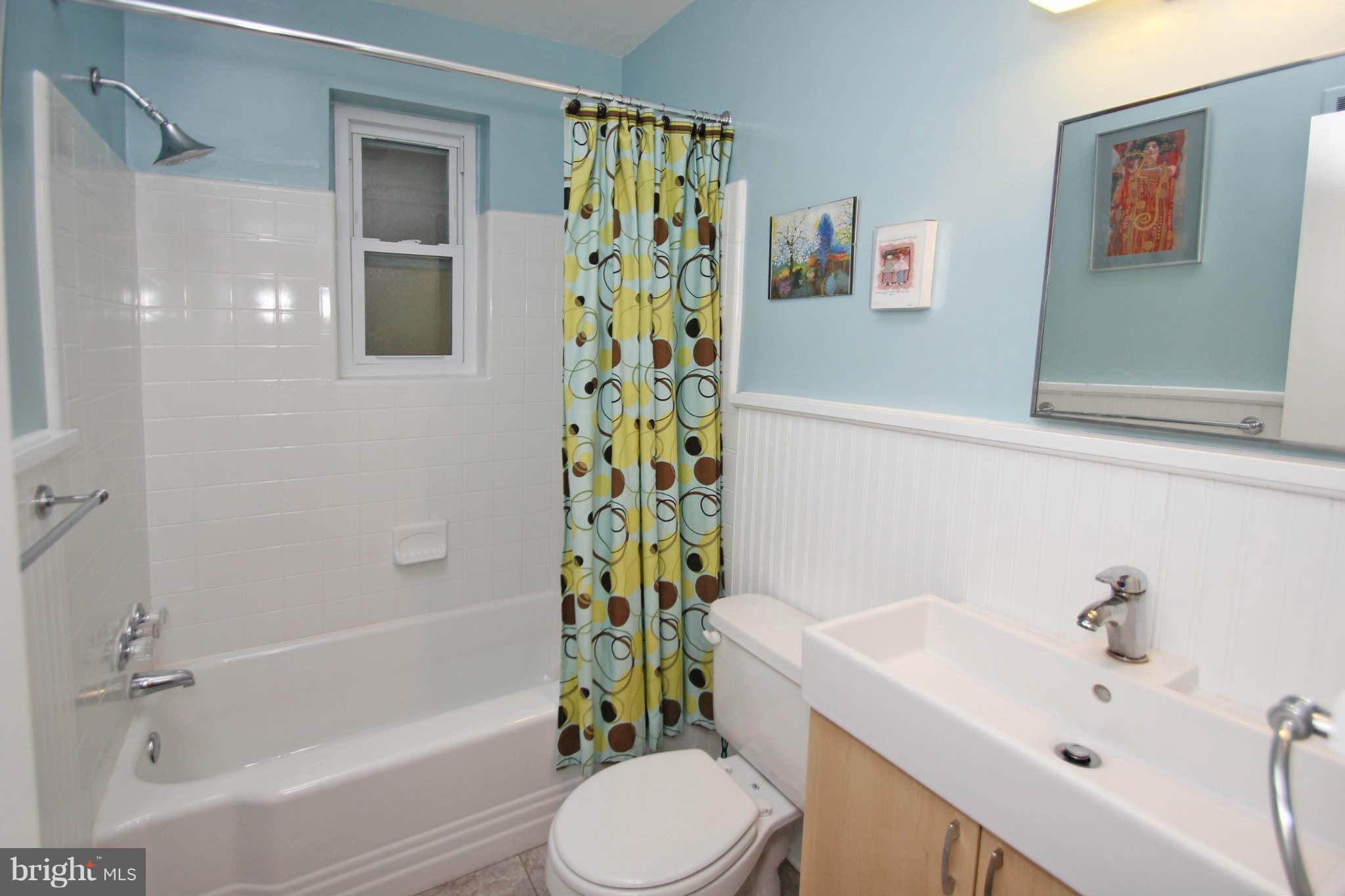 4 Oldham Road Silver Spring, MD 20901 - Photo 20 of 27 a bathroom with a sink toilet and shower