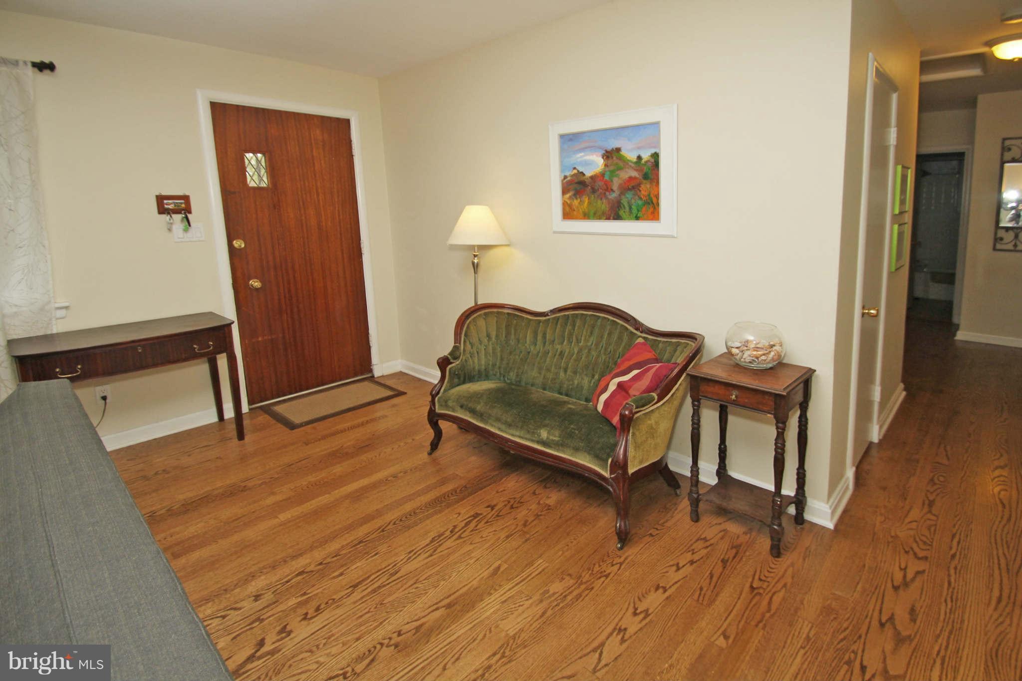 4 Oldham Road Silver Spring, MD 20901 - Photo 3 of 27 a living room with furniture and a wooden floor
