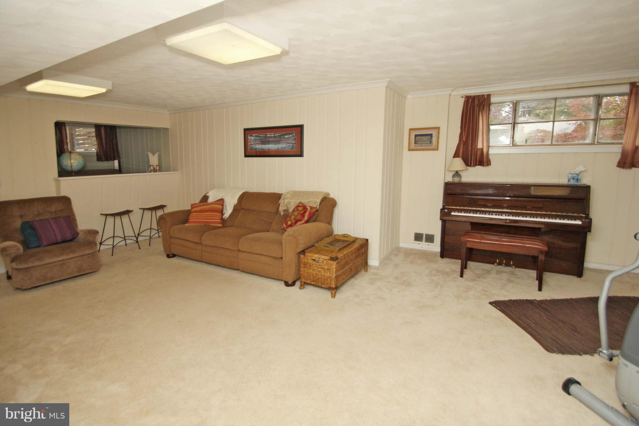 4 Oldham Road Silver Spring, MD 20901 - Photo 23 of 27 a living room with furniture and a flat screen tv