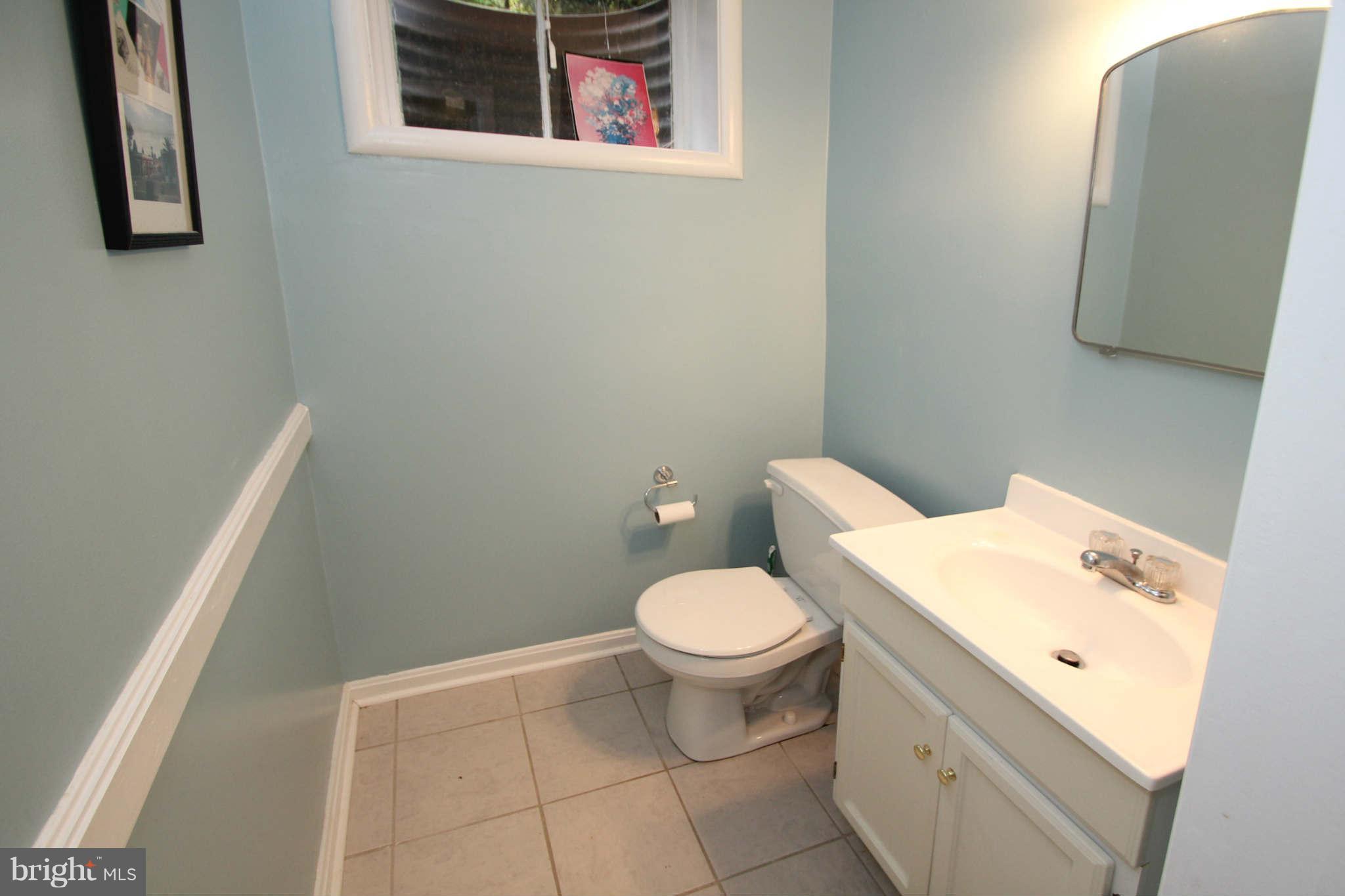 4 Oldham Road Silver Spring, MD 20901 - Photo 24 of 27 a white toilet sitting next to a bathroom sink