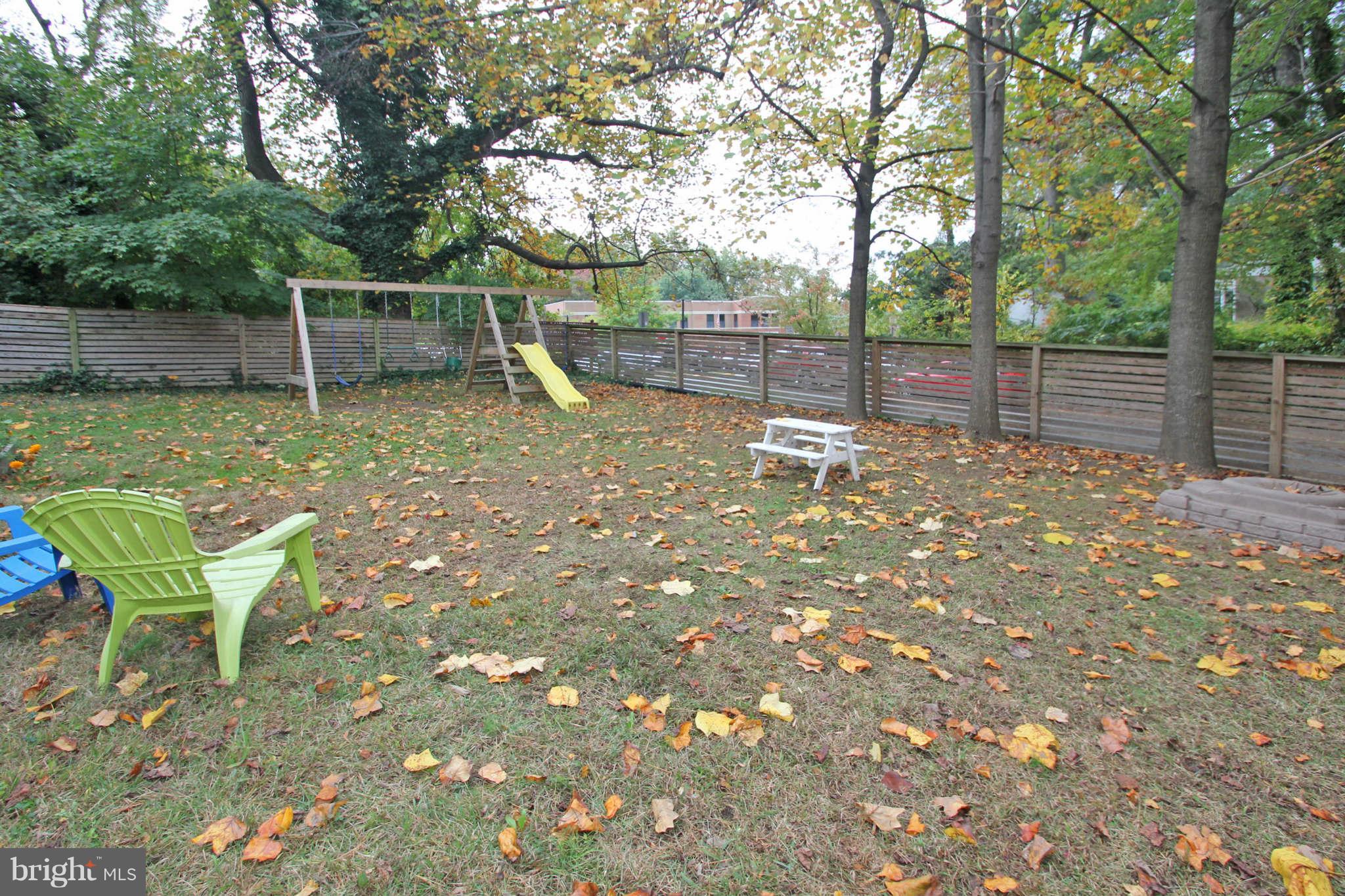 4 Oldham Road Silver Spring, MD 20901 - Photo 27 of 27 a backyard of a house with table and chairs