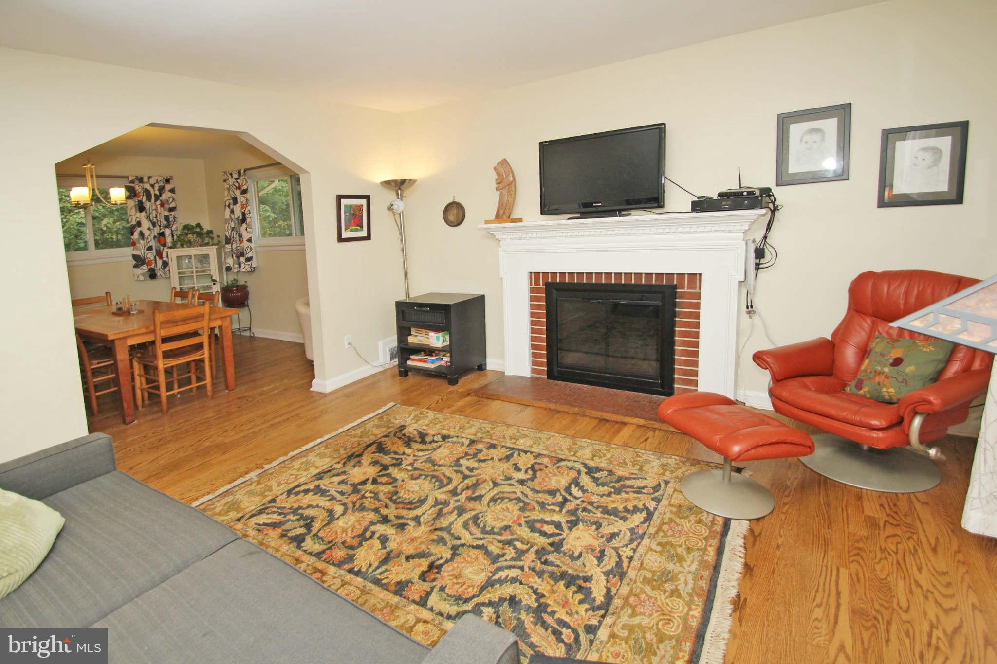 4 Oldham Road Silver Spring, MD 20901 - Photo 5 of 27 a living room with furniture fireplace and flat screen tv