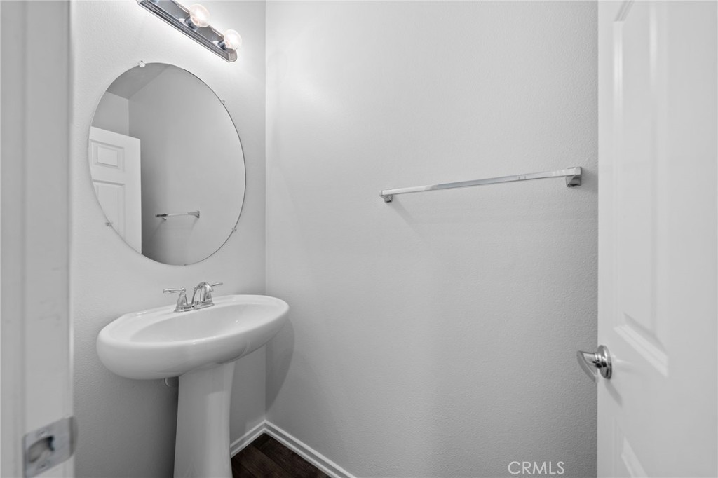 259 Spotted Saddle Way Fallbrook, CA 92028 - Photo 11 of 43 a bathroom with a sink and a mirror
