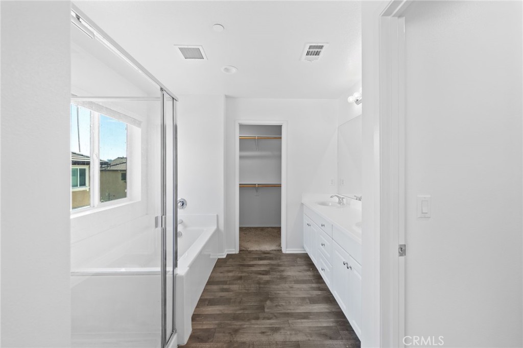 259 Spotted Saddle Way Fallbrook, CA 92028 - Photo 19 of 43 a view of a hallway with white doors