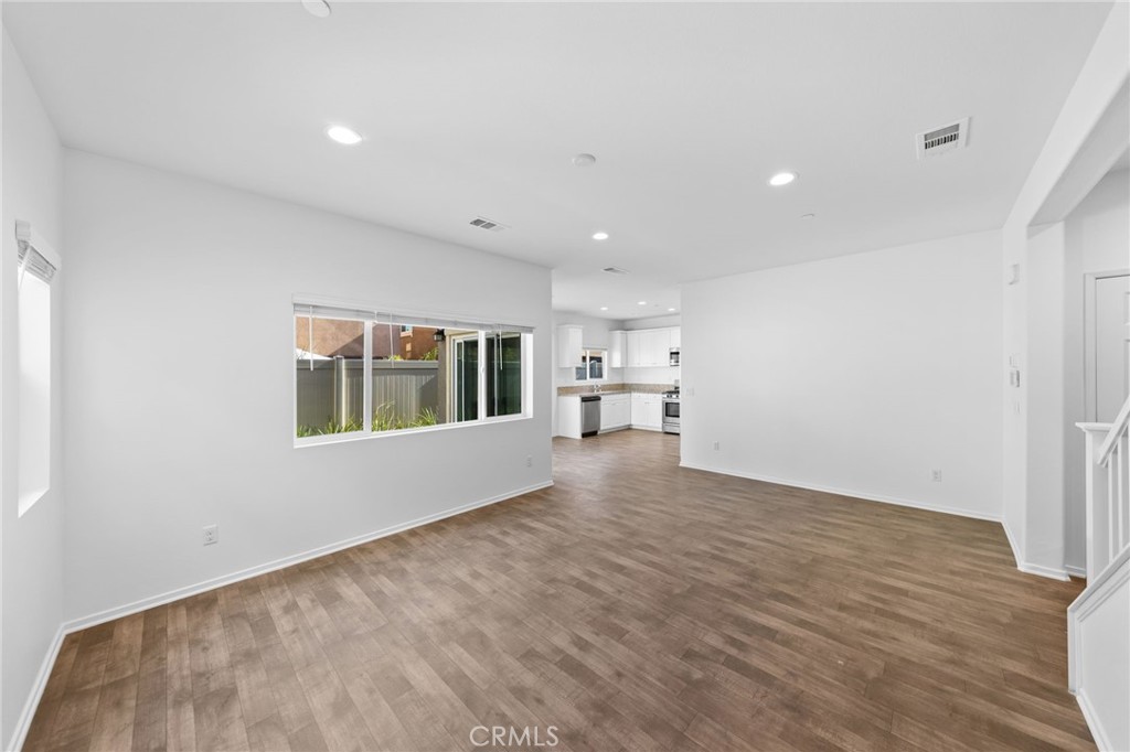 259 Spotted Saddle Way Fallbrook, CA 92028 - Photo 5 of 43 a view of empty room with wooden floor and window