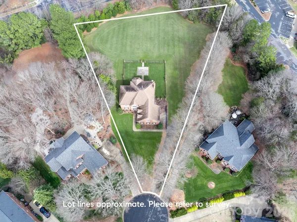 an aerial view of a house with outdoor space