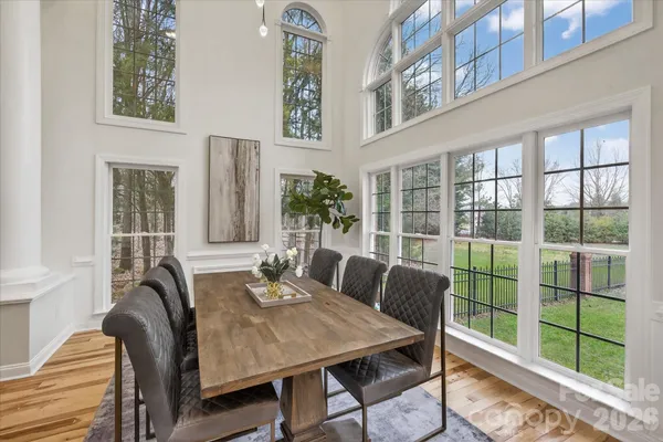a view of a dining room with furniture window and wooden floor