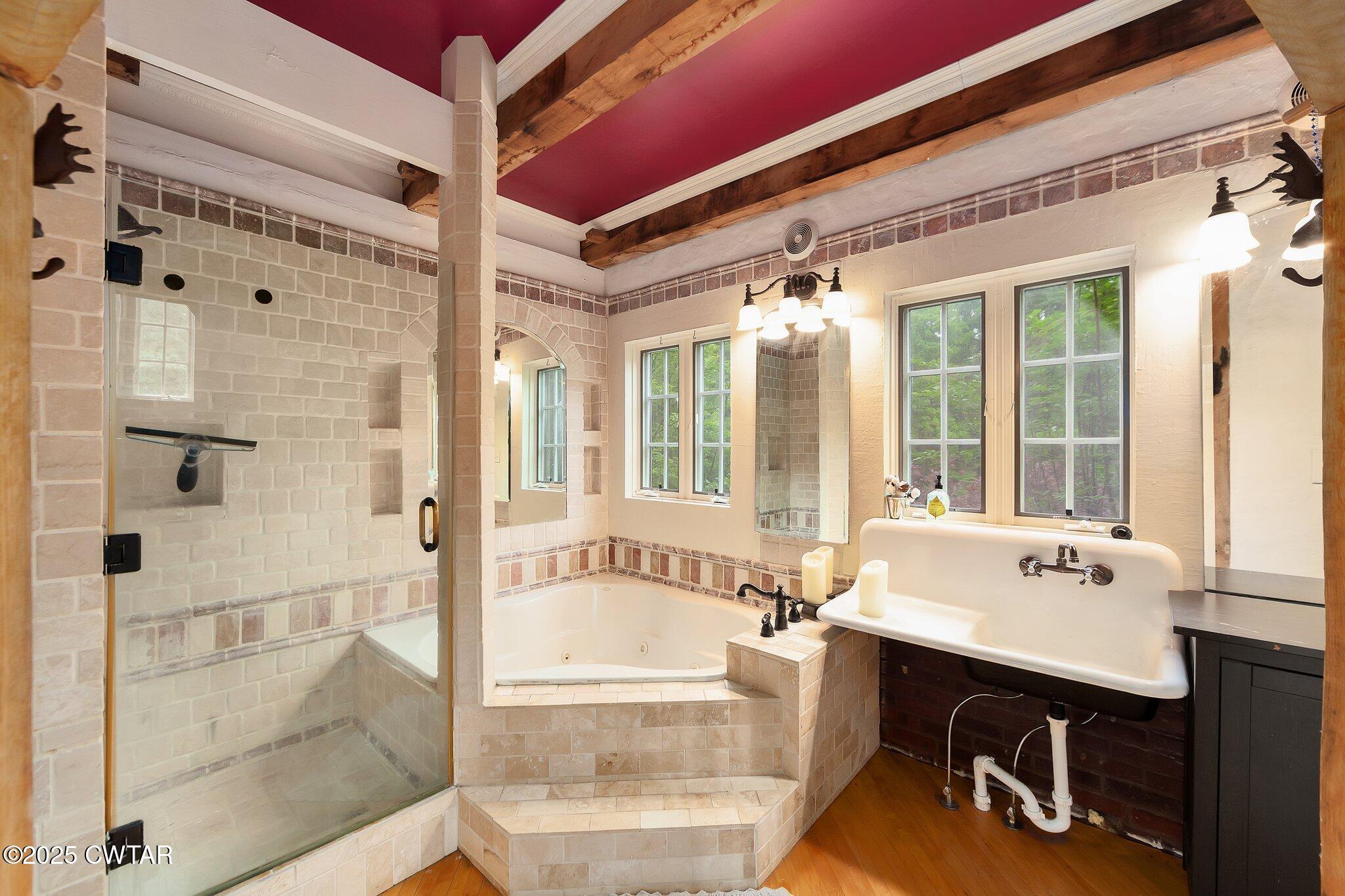 1620 Dry Creek Road Pinson, TN 38366 - Photo 15 of 51 a bathroom with a bathtub and a sink