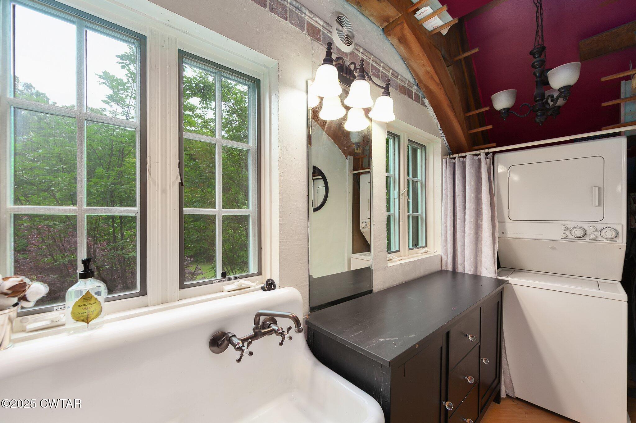1620 Dry Creek Road Pinson, TN 38366 - Photo 17 of 51 a bathroom with a sink a toilet and a window