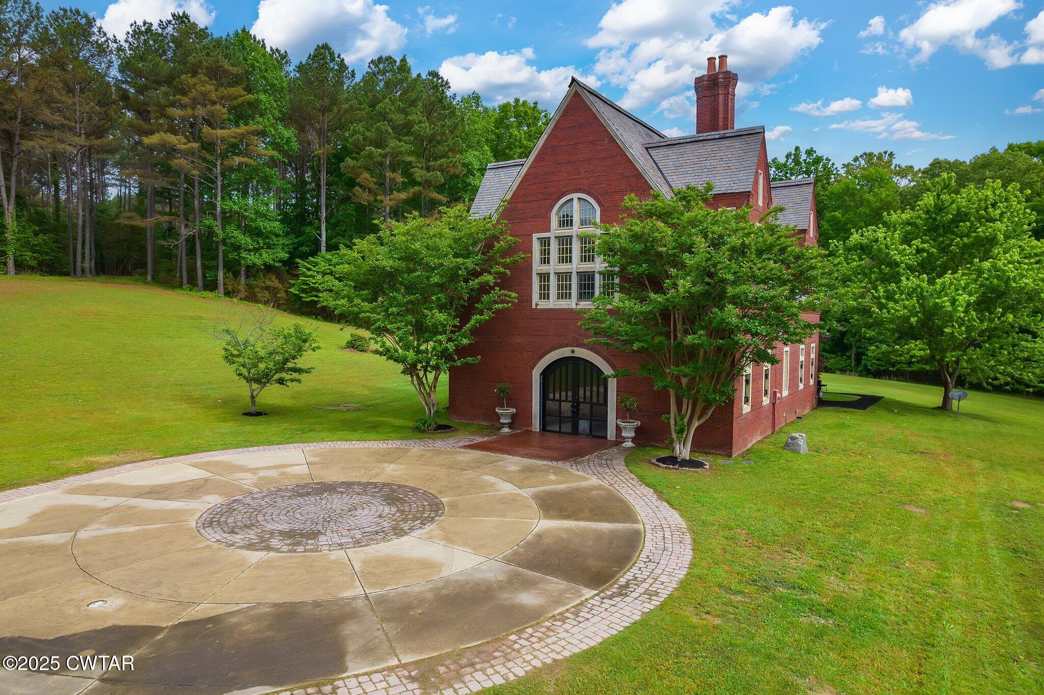 1620 Dry Creek Road Pinson, TN 38366 - Photo 2 of 51 a swimming pool with outdoor seating and yard