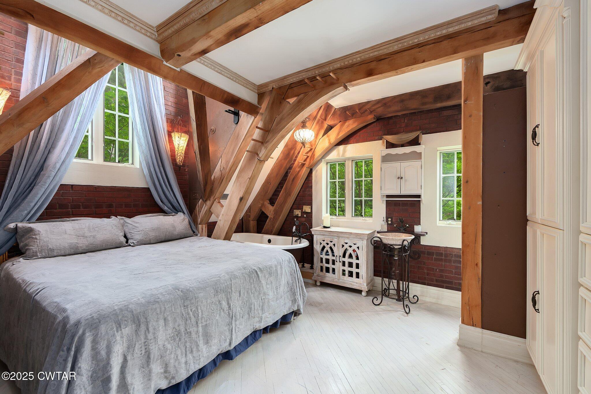 1620 Dry Creek Road Pinson, TN 38366 - Photo 23 of 51 a bedroom with a bed and a window