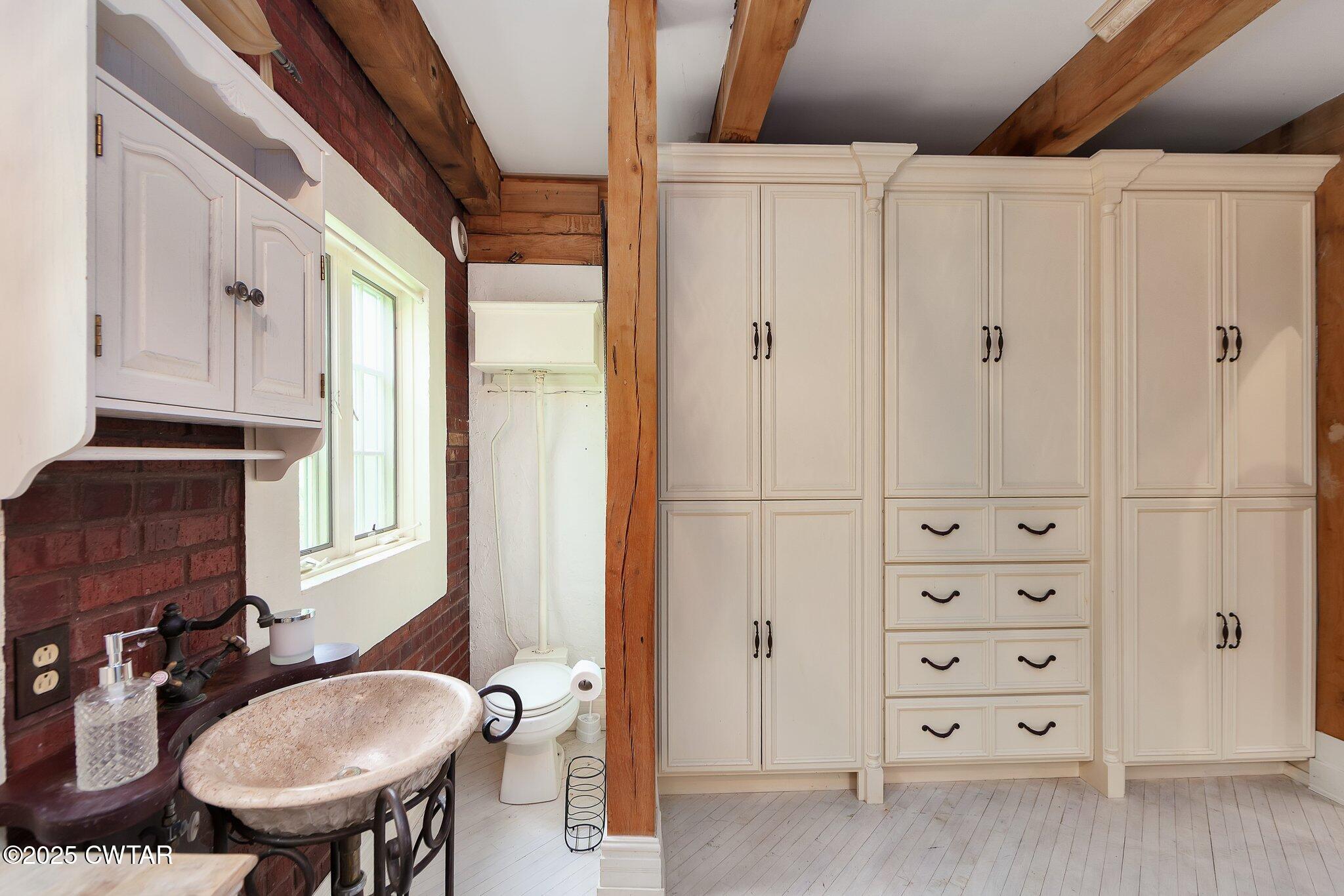 1620 Dry Creek Road Pinson, TN 38366 - Photo 24 of 51 a bathroom with a sink a toilet and shower