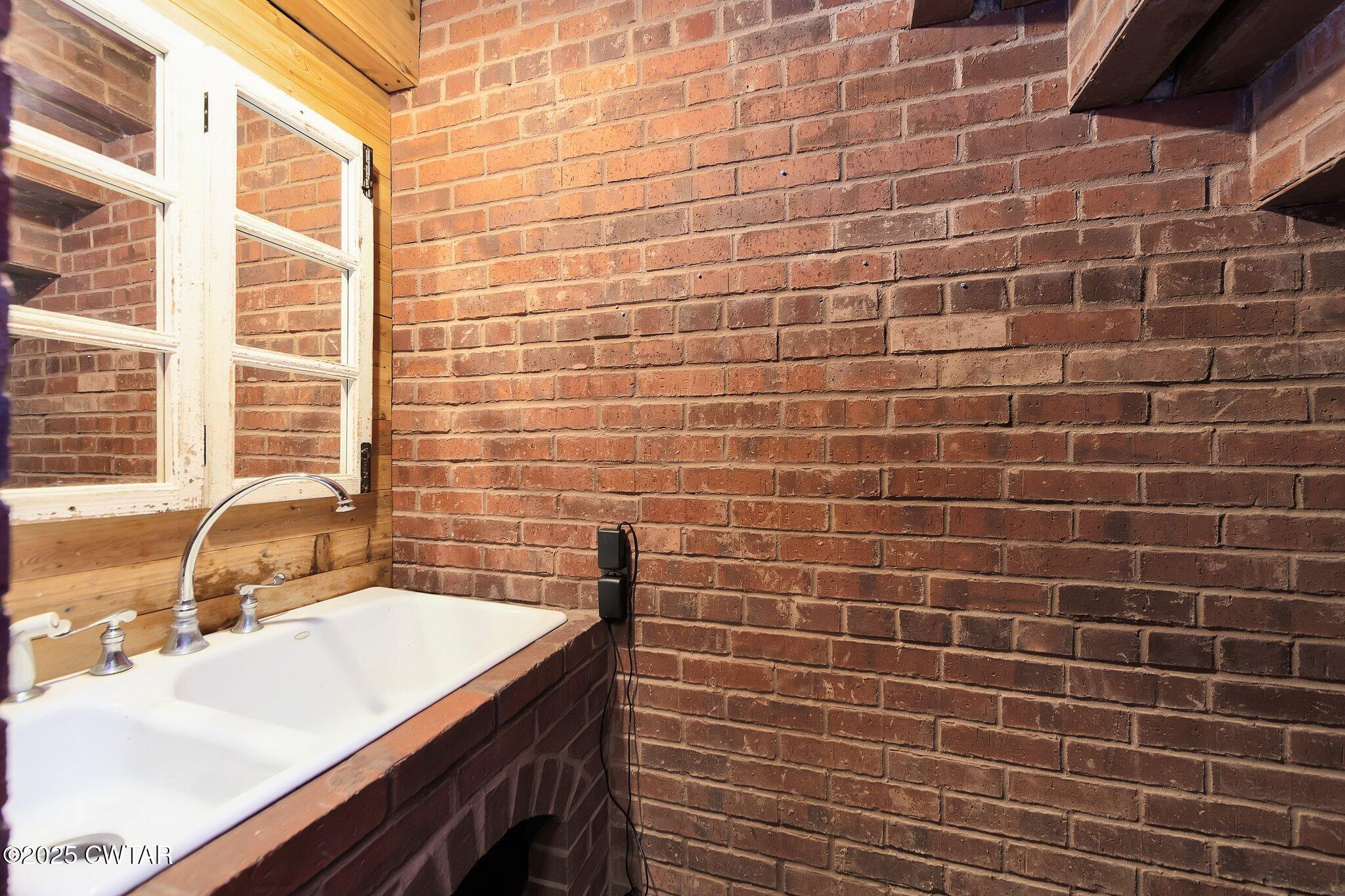 1620 Dry Creek Road Pinson, TN 38366 - Photo 26 of 51 a bathroom with a sink and a bathtub