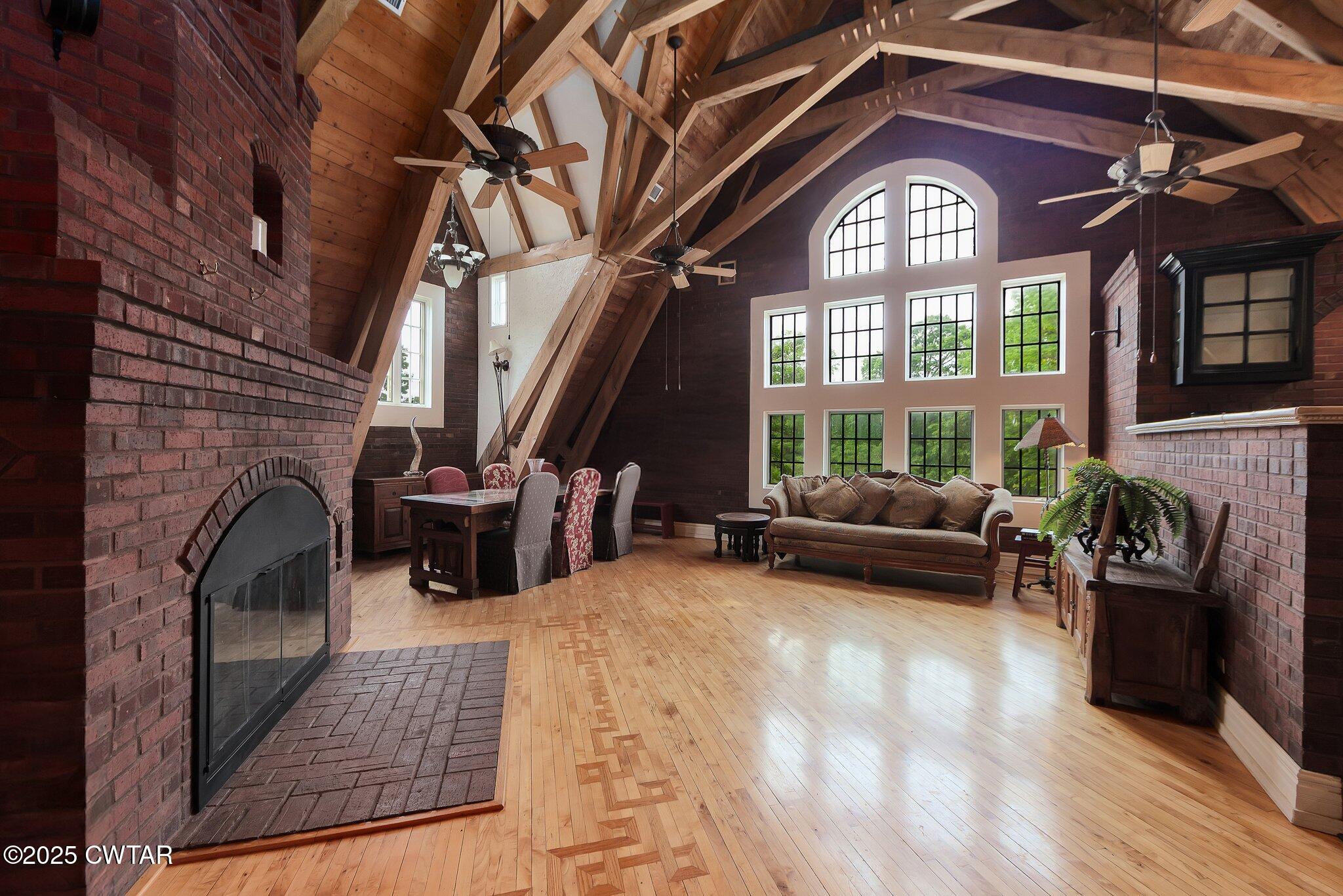1620 Dry Creek Road Pinson, TN 38366 - Photo 3 of 51 a living room with furniture a fireplace and a large window
