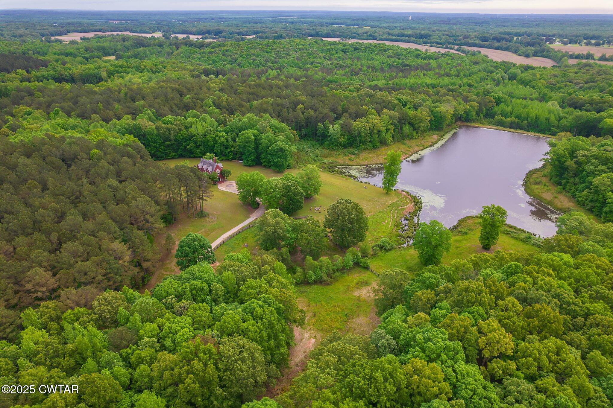1620 Dry Creek Road Pinson, TN 38366 - Photo 38 of 51 an aerial view of residential houses with outdoor space and trees