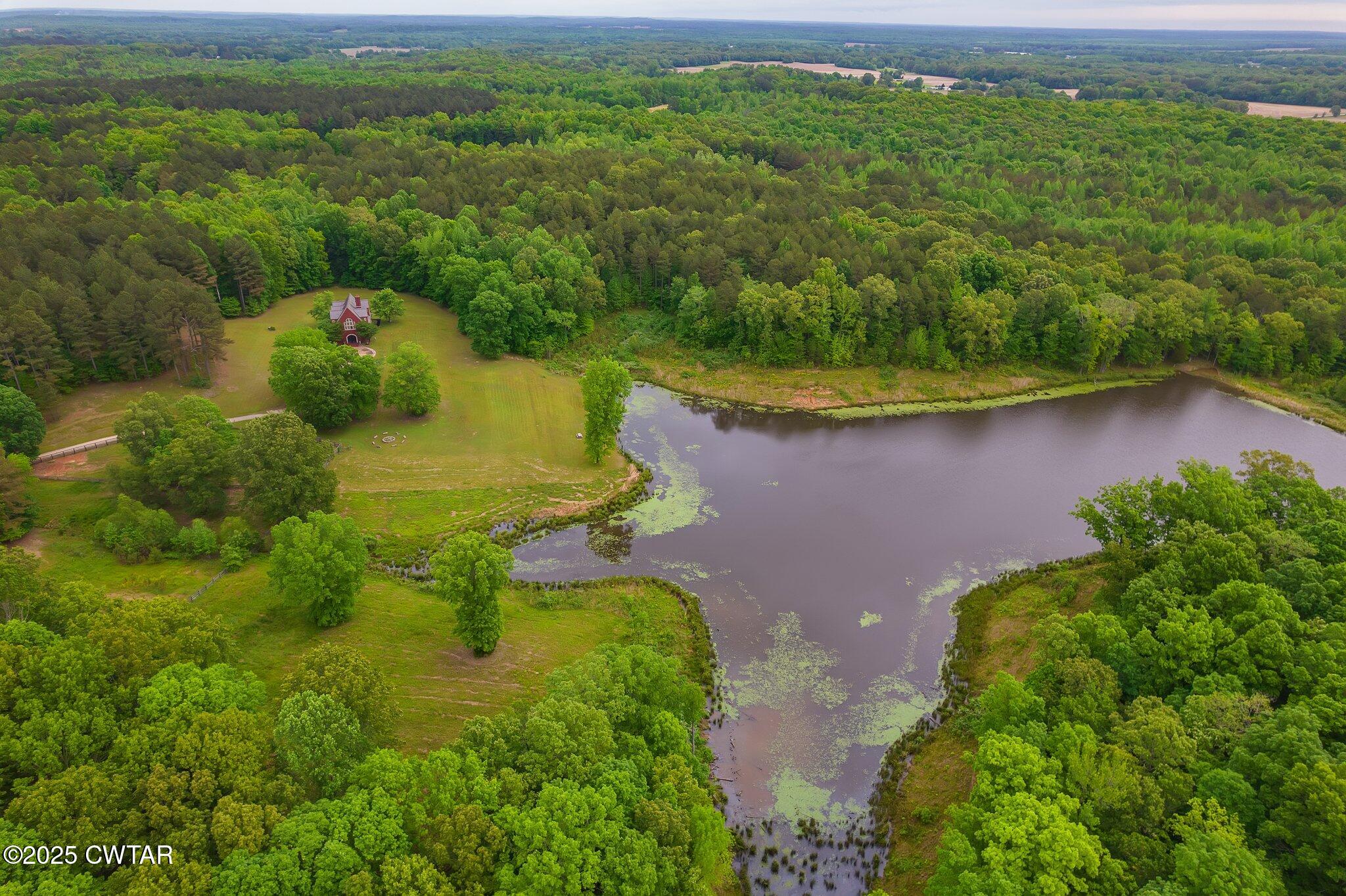 1620 Dry Creek Road Pinson, TN 38366 - Photo 40 of 51 an aerial view of a house with a yard