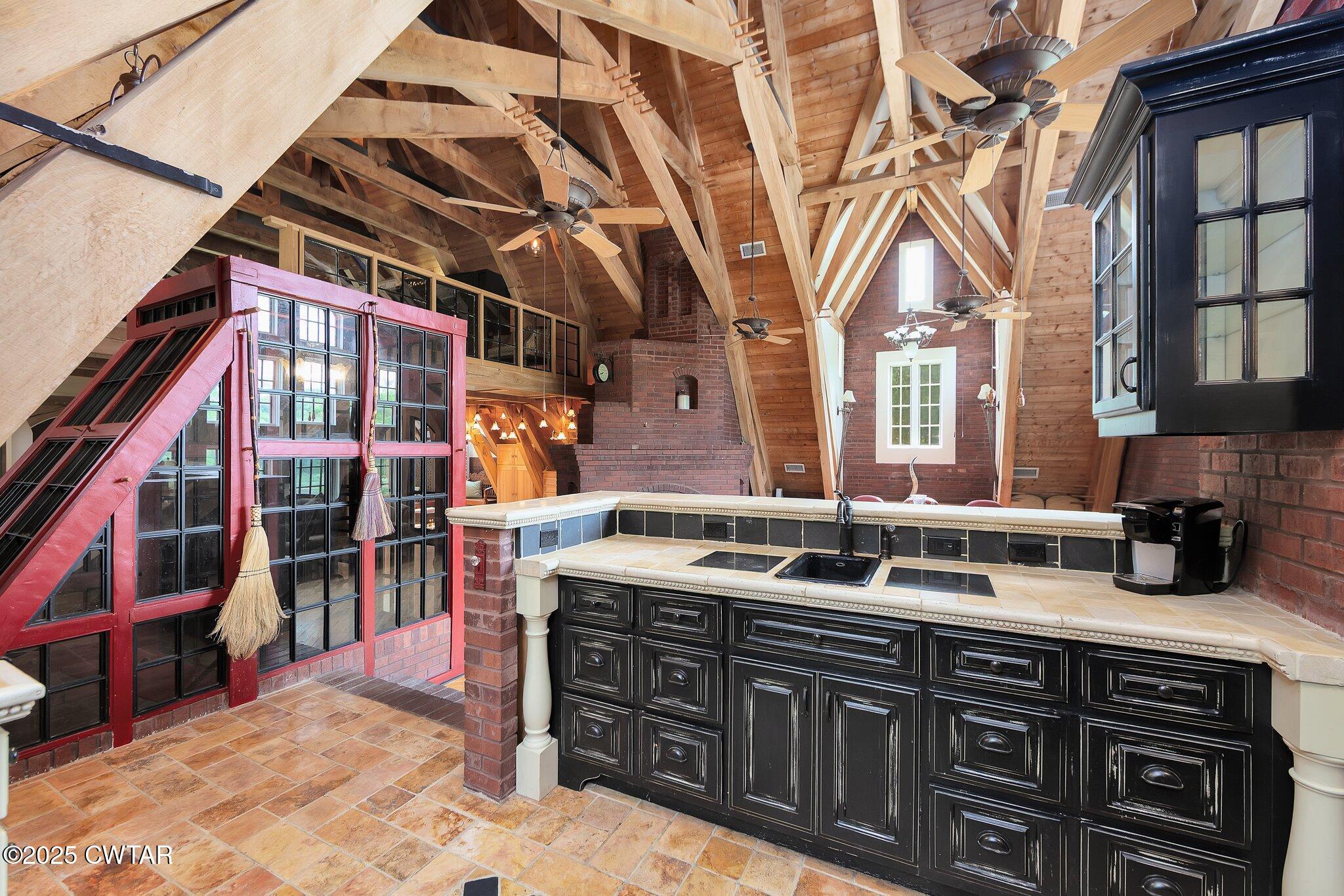 1620 Dry Creek Road Pinson, TN 38366 - Photo 4 of 51 a kitchen with stainless steel appliances granite countertop a sink and cabinets