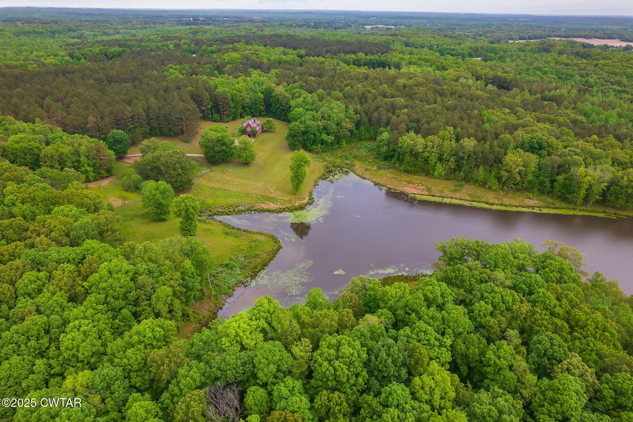 1620 Dry Creek Road Pinson, TN 38366 - Photo 41 of 51 a view of a lake with a yard