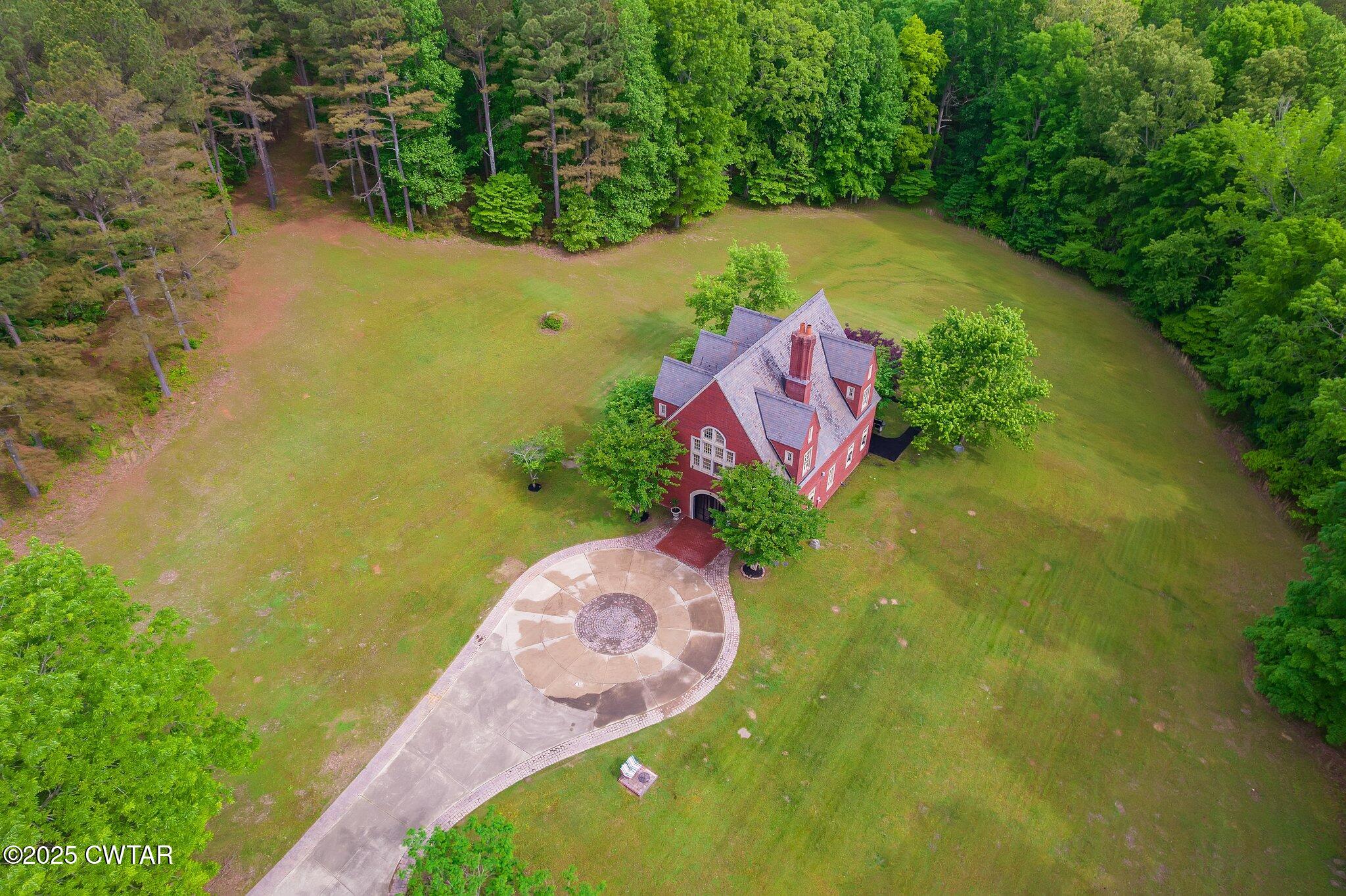 1620 Dry Creek Road Pinson, TN 38366 - Photo 42 of 51 a view of a lake from a yard