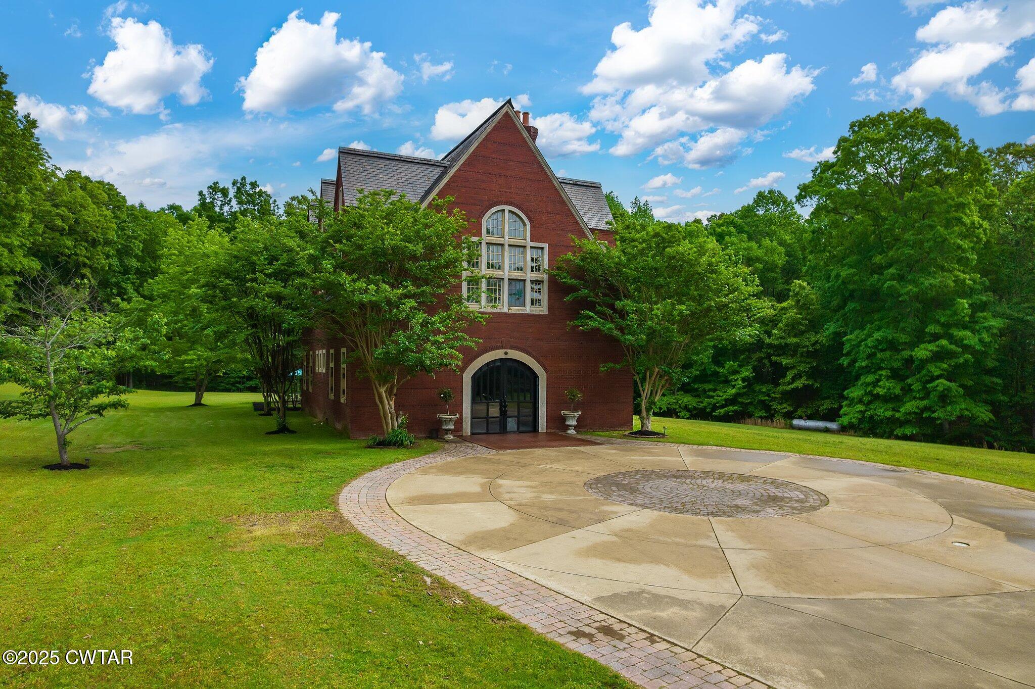 1620 Dry Creek Road Pinson, TN 38366 - Photo 43 of 51 a front view of a house with a yard