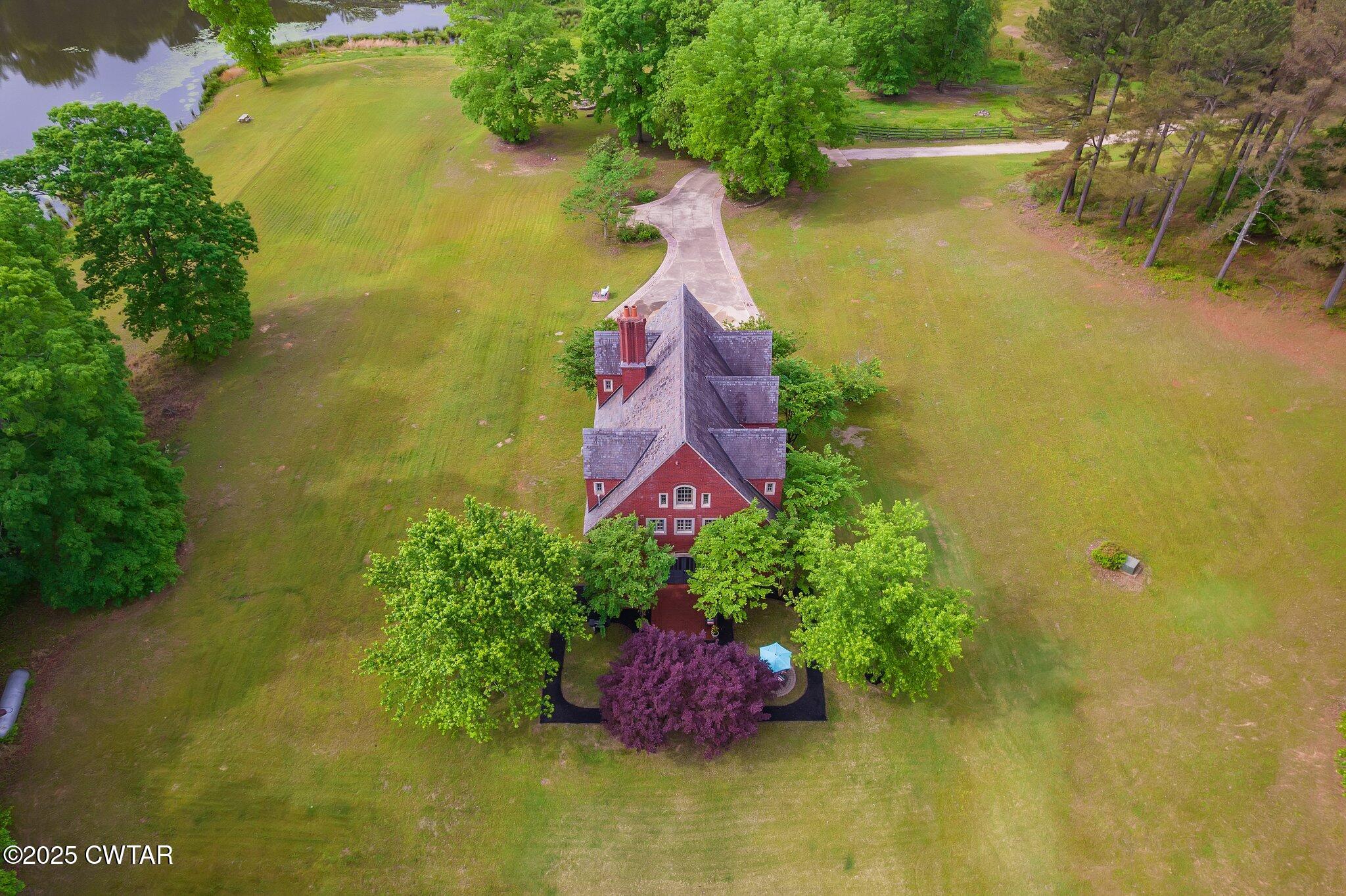1620 Dry Creek Road Pinson, TN 38366 - Photo 49 of 51 a aerial view of residential house with swimming pool and outdoor space