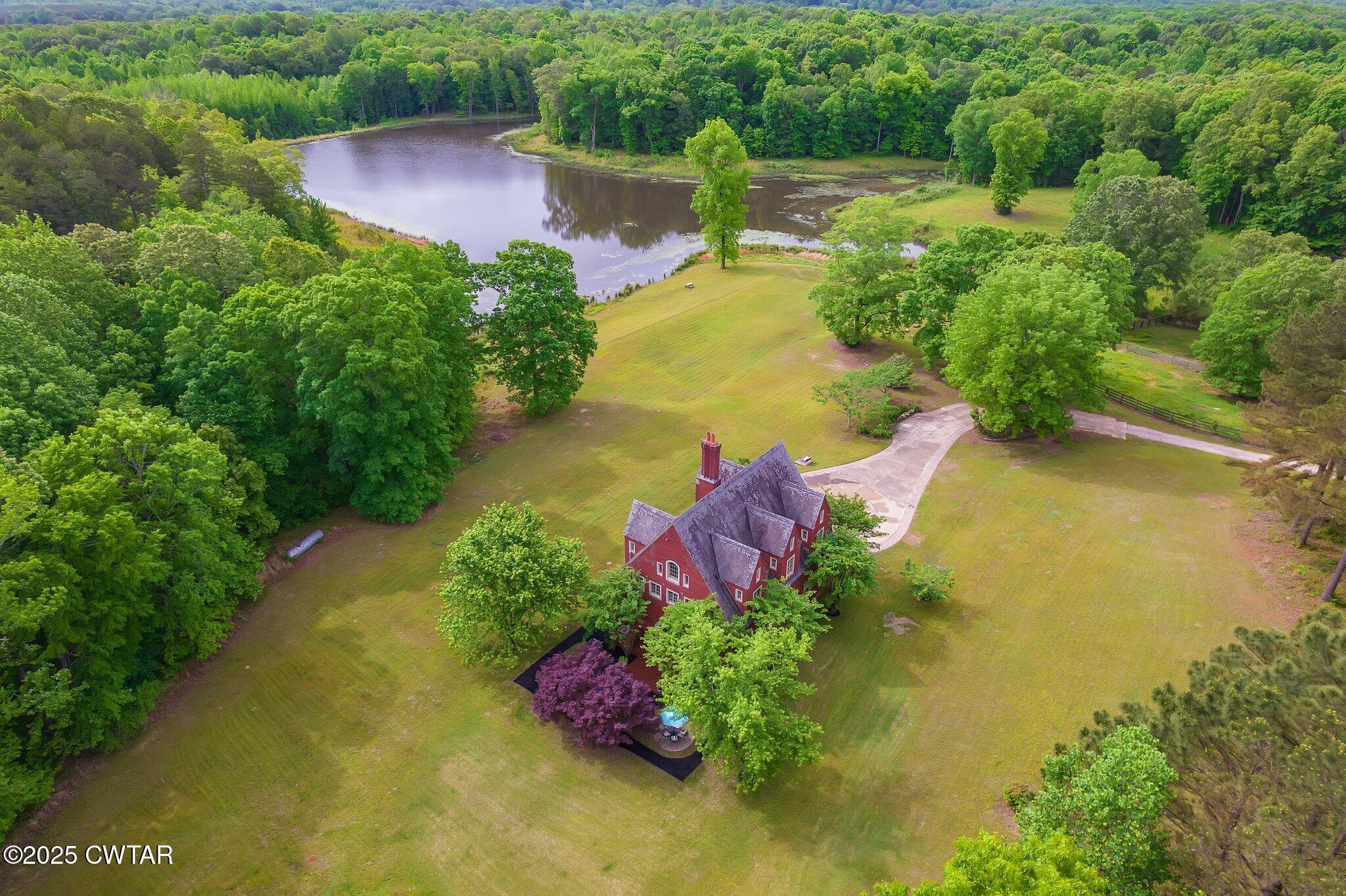 1620 Dry Creek Road Pinson, TN 38366 - Photo 51 of 51 an aerial view of a house with a yard and lake view