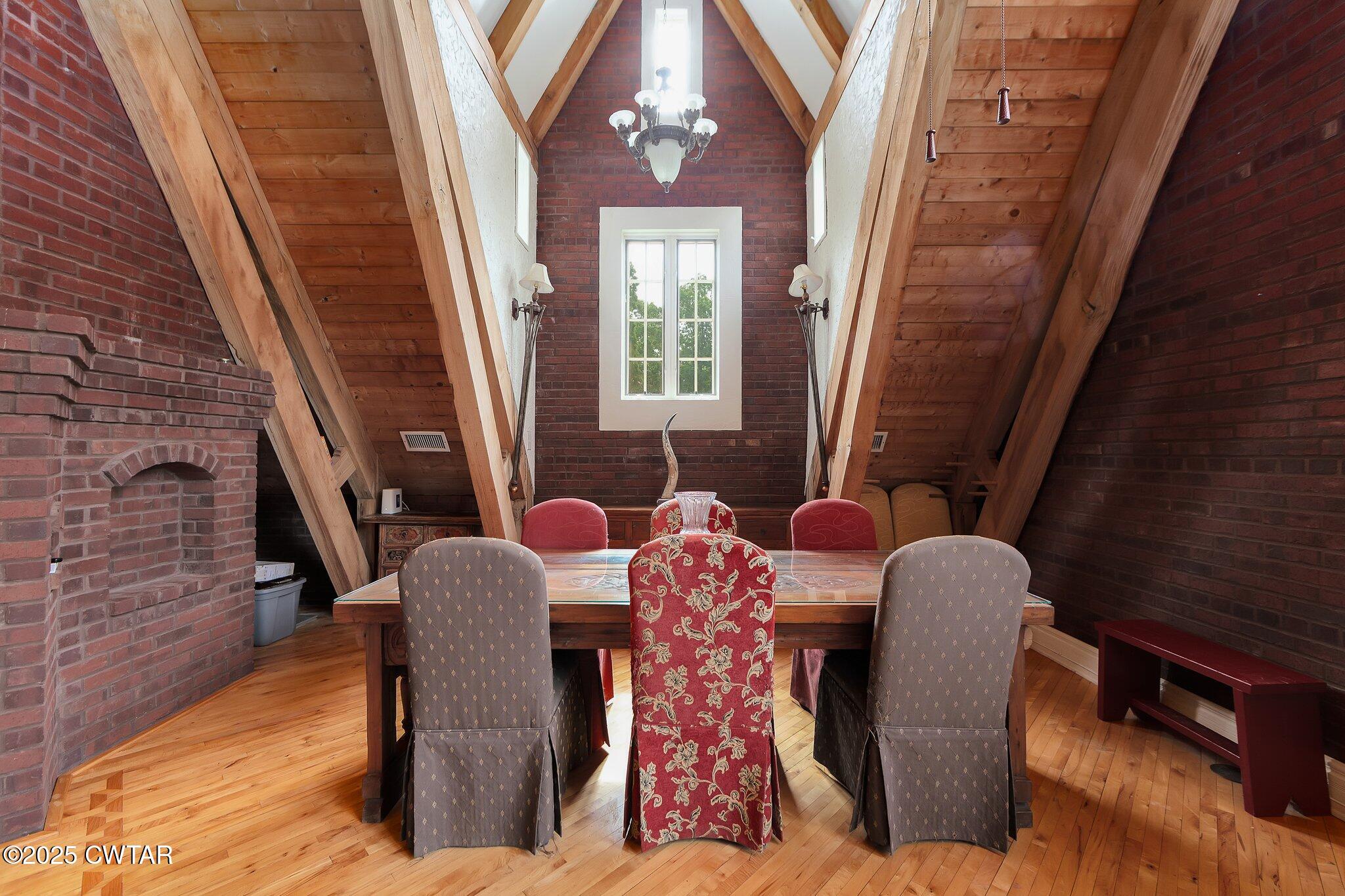 1620 Dry Creek Road Pinson, TN 38366 - Photo 8 of 51 a view of a dining room with furniture and wooden floor