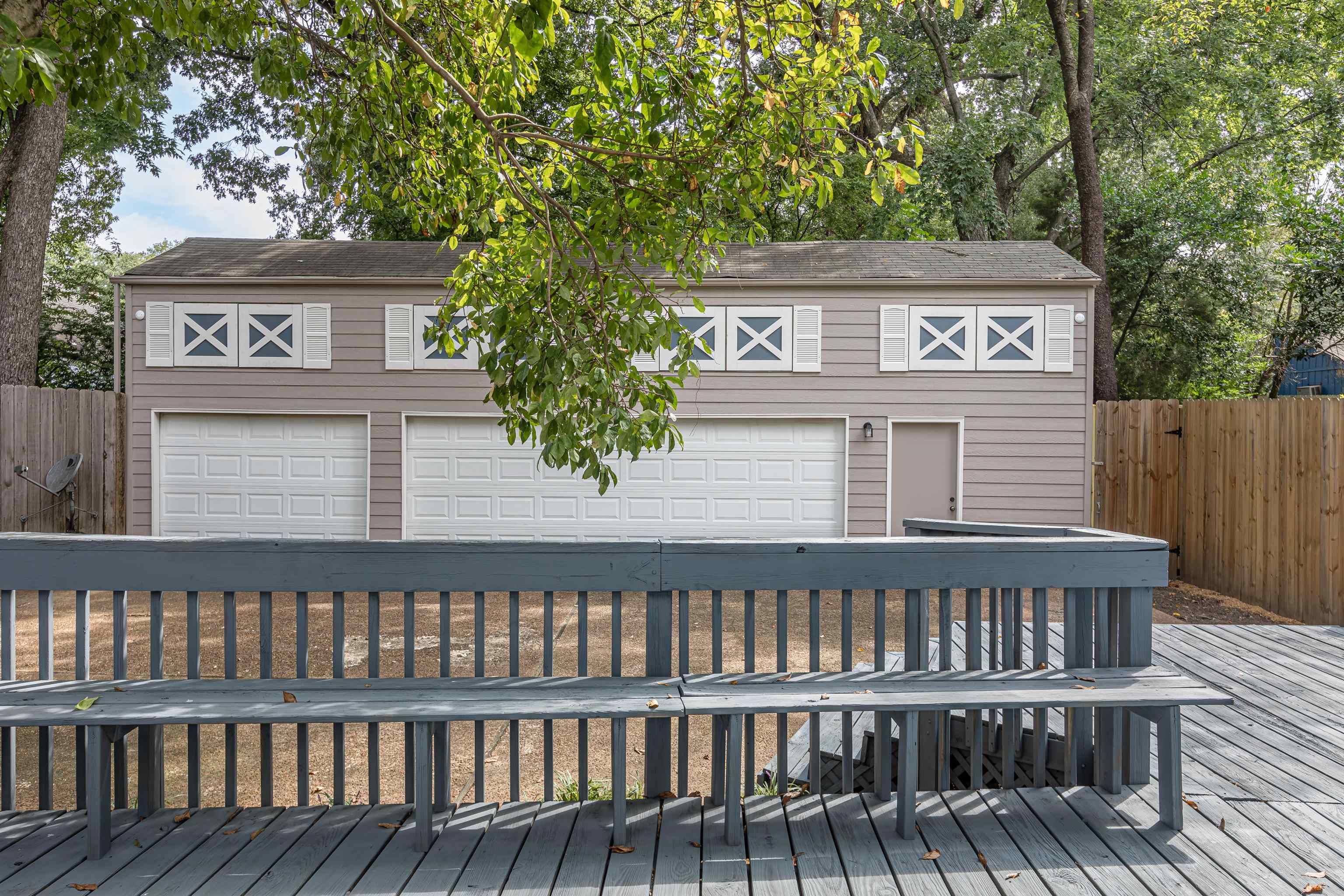 590 South Rembert Street Memphis, TN 38104 - Photo 14 of 18 There is a floored second story above the parking spaces. The garage has fresh paint and newly installed siding and trim.