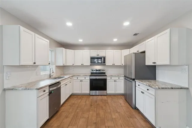 a kitchen with a sink and a window