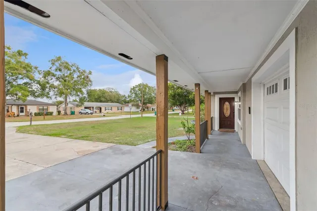 a view of a porch and garden