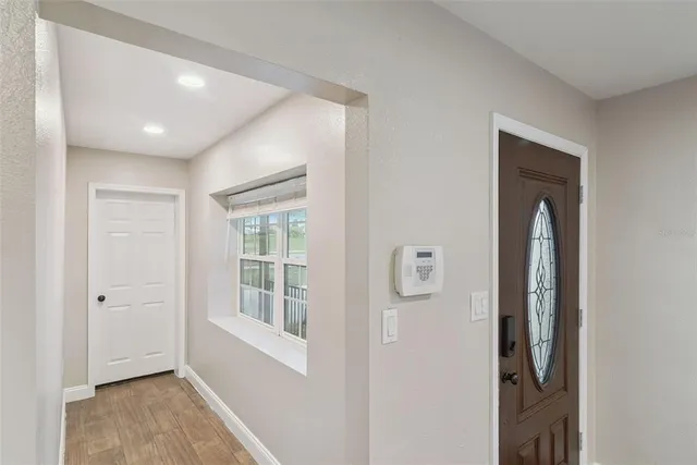 a view of a kitchen with a sink and a window