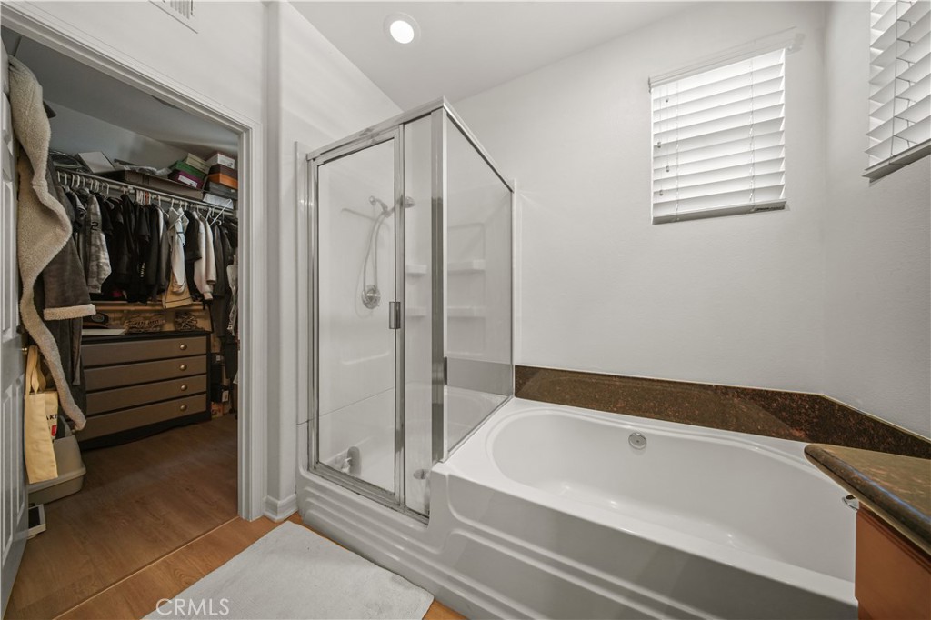 19 Sklar Street Ladera Ranch, CA 92694 - Photo 15 of 26 a bathroom with a bathtub and a shower