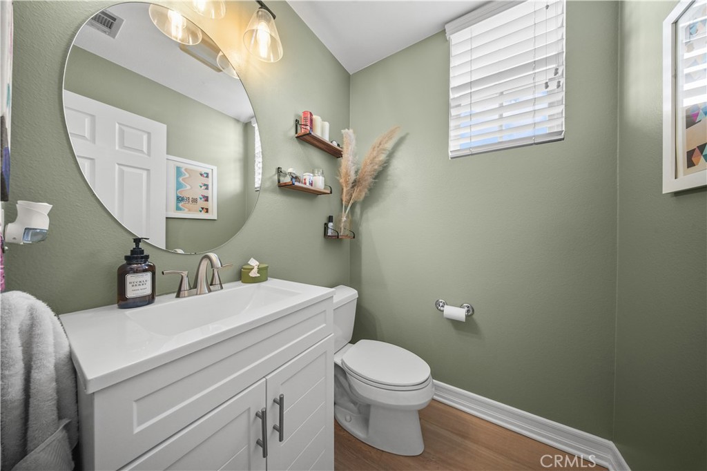 19 Sklar Street Ladera Ranch, CA 92694 - Photo 19 of 26 a bathroom with a toilet sink and mirror