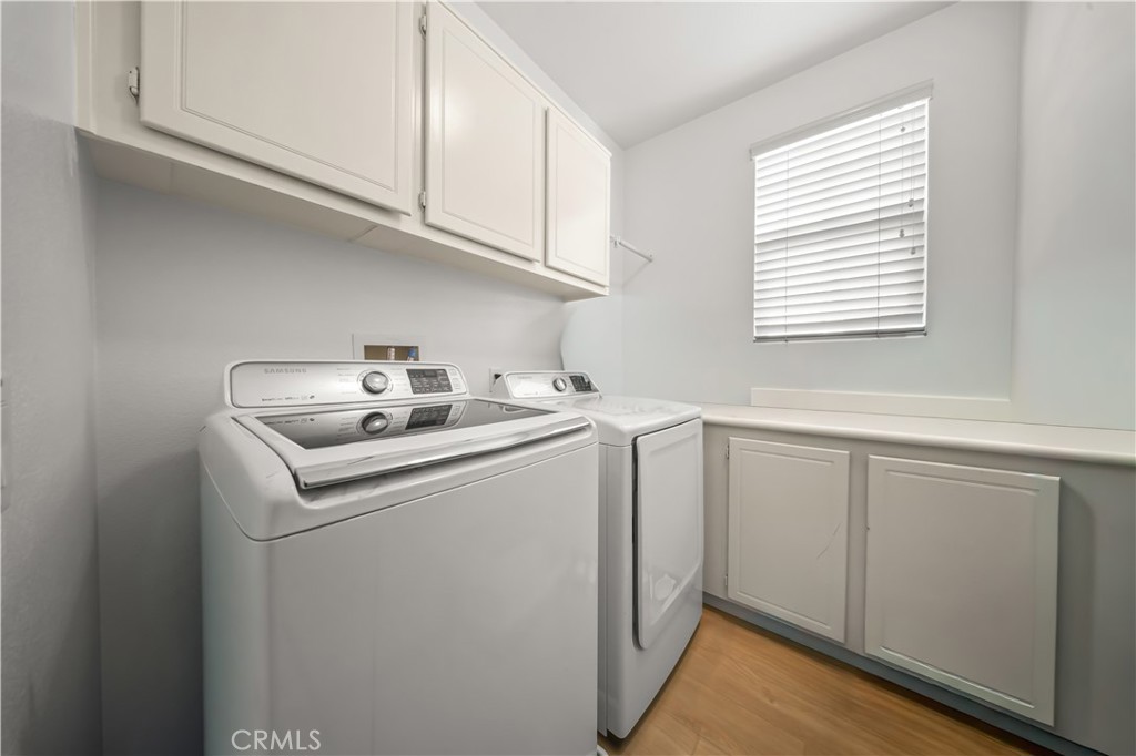 19 Sklar Street Ladera Ranch, CA 92694 - Photo 20 of 26 a utility room with sink dryer and washer