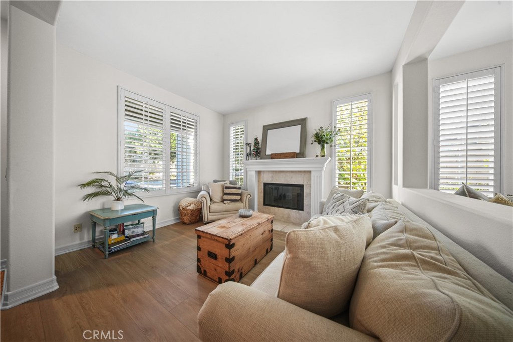19 Sklar Street Ladera Ranch, CA 92694 - Photo 6 of 26 a living room with furniture and a fireplace