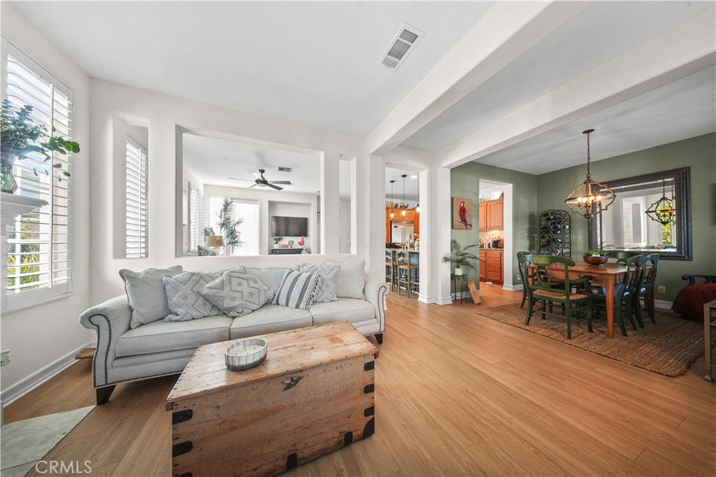 19 Sklar Street Ladera Ranch, CA 92694 - Photo 7 of 26 a living room with furniture and a large window
