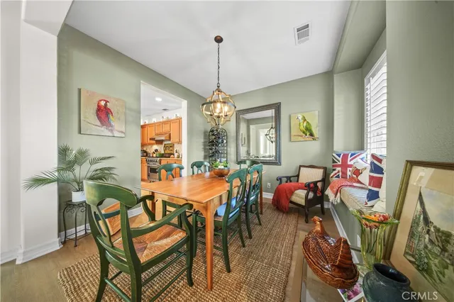 a view of a dining room with furniture and window