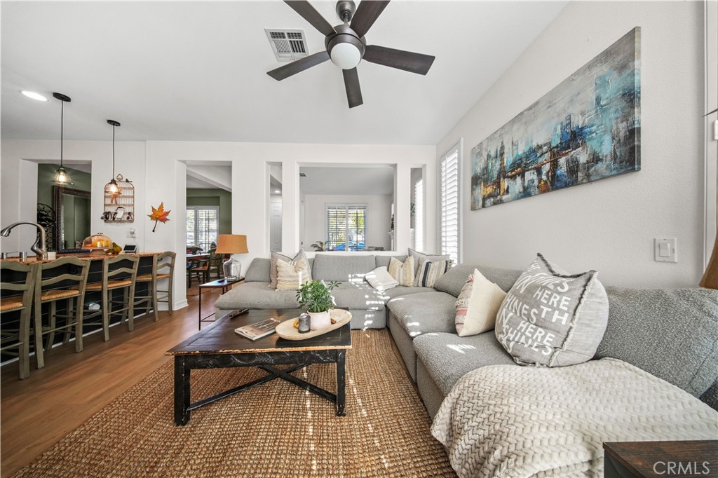 19 Sklar Street Ladera Ranch, CA 92694 - Photo 10 of 26 a living room with furniture and a wooden floor
