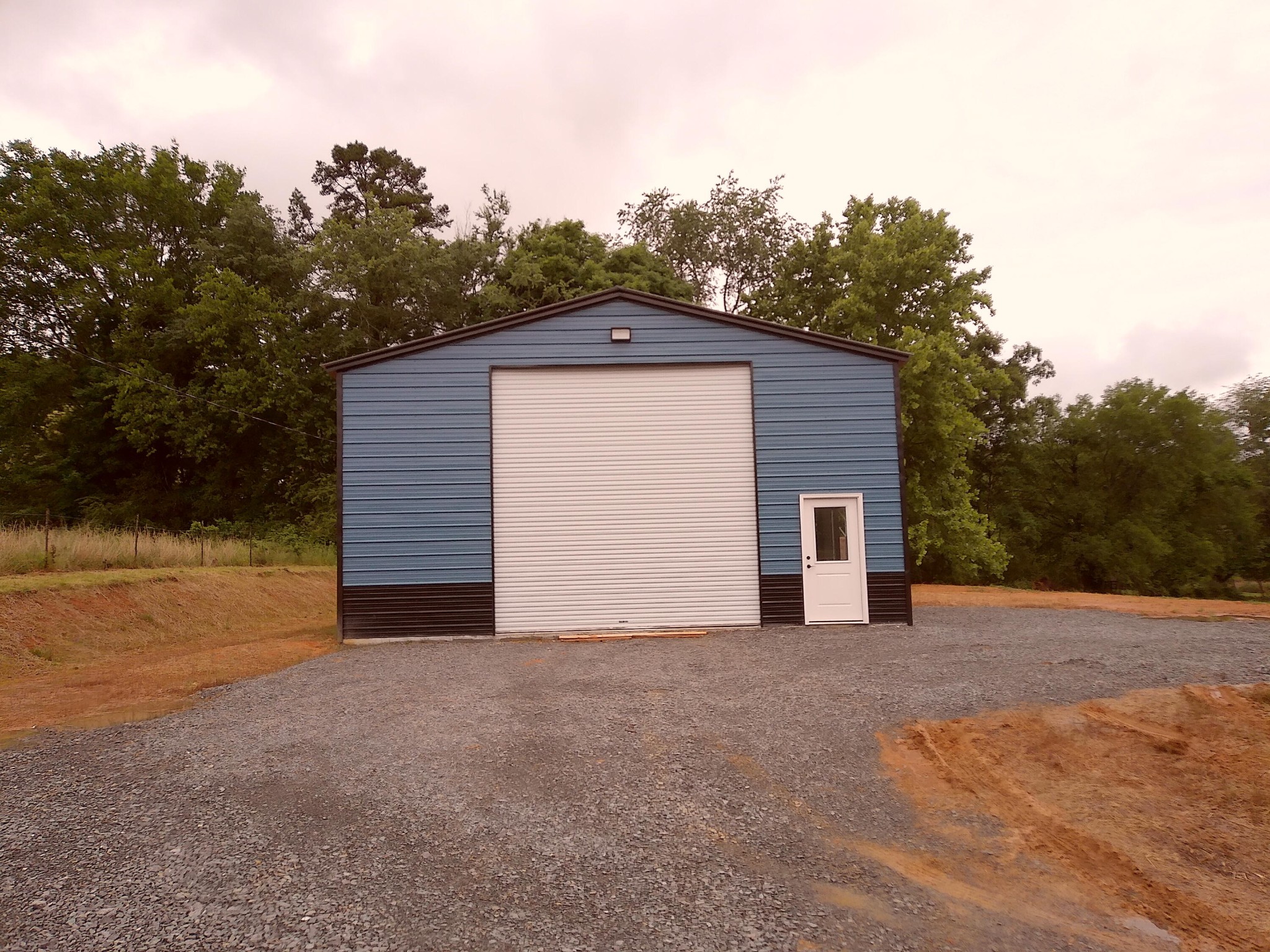 5668 Tennessee 58 Decatur, TN 37322 - Photo 2 of 24 a view of a house with a small yard and garage