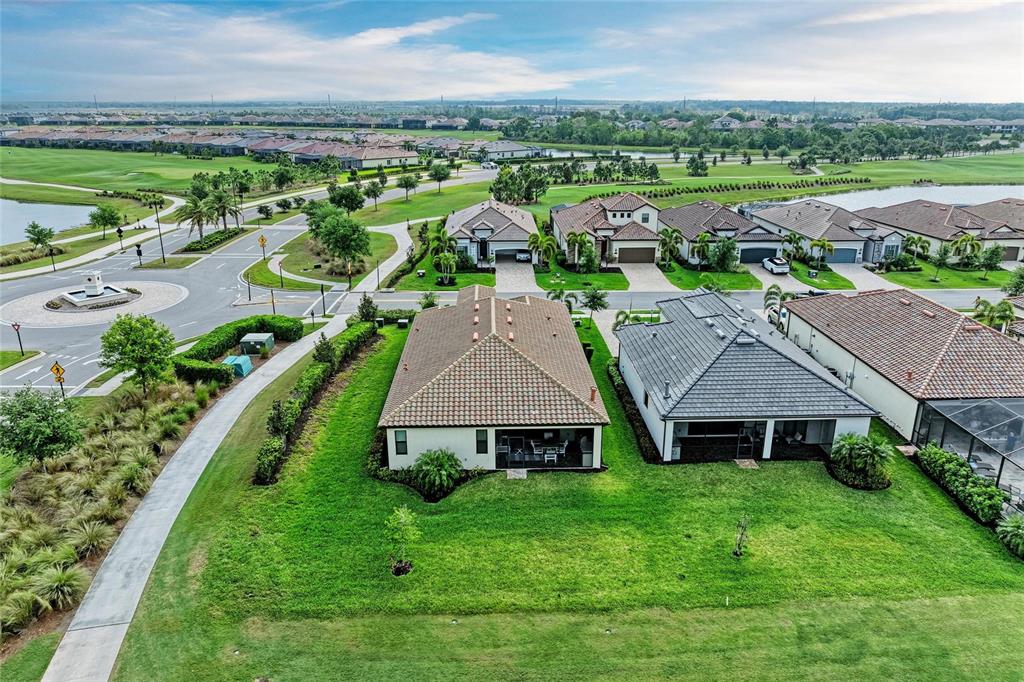 5810 Brandon Run Bradenton, FL 34211 - Photo 64 of 65 an aerial view of a house with outdoor space and lake view