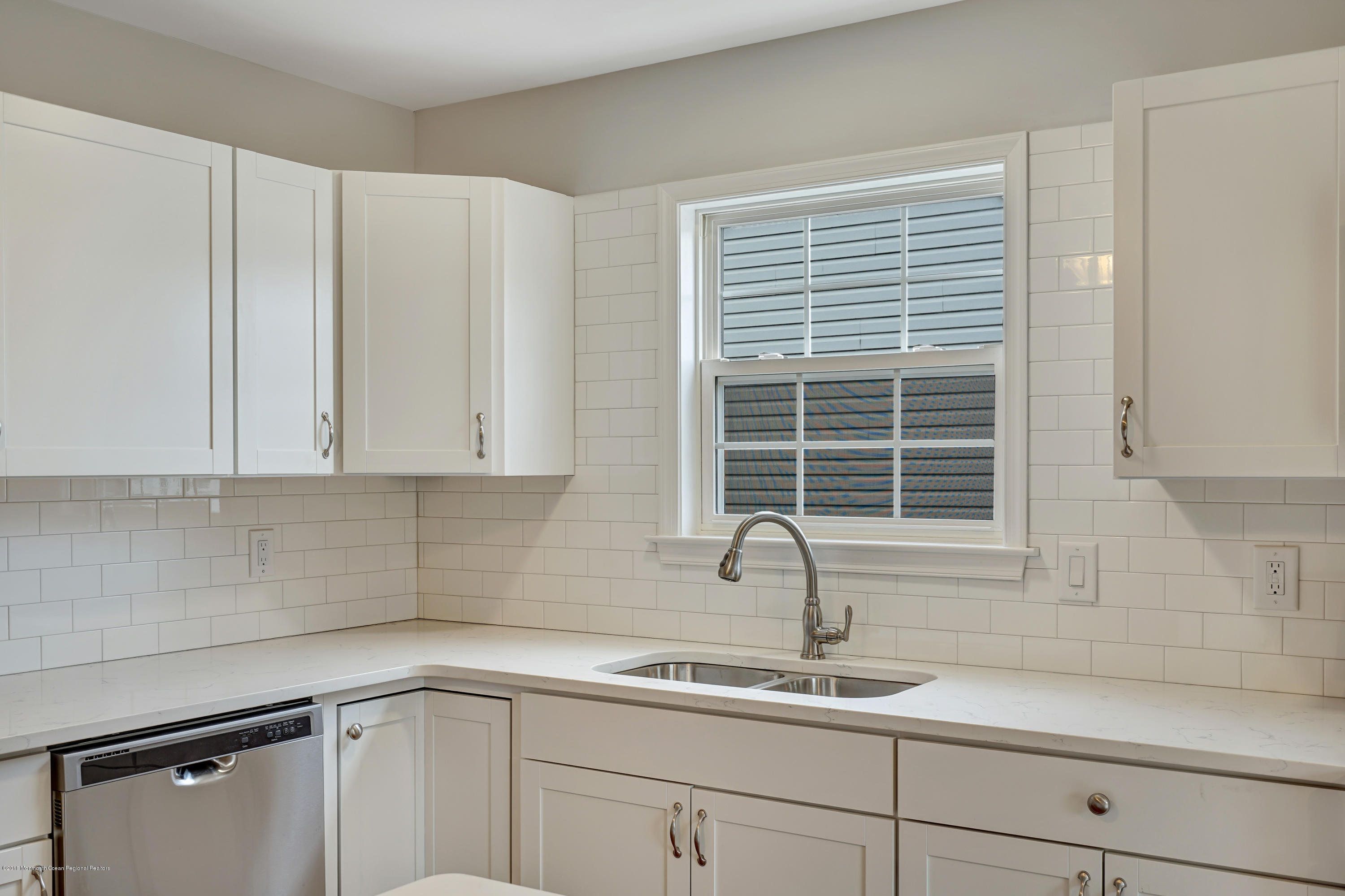 152 Bowline Road Manahawkin, NJ 08050 - Photo 11 of 29 a kitchen with a sink cabinets and window